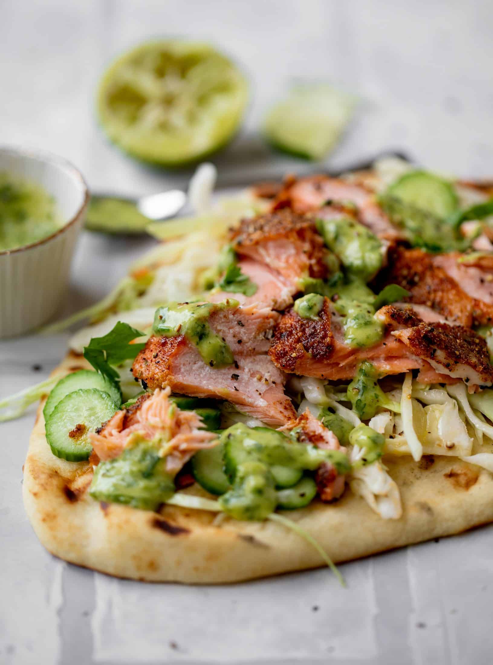 grilled salmon on naan bread with slaw and cilantro sauce