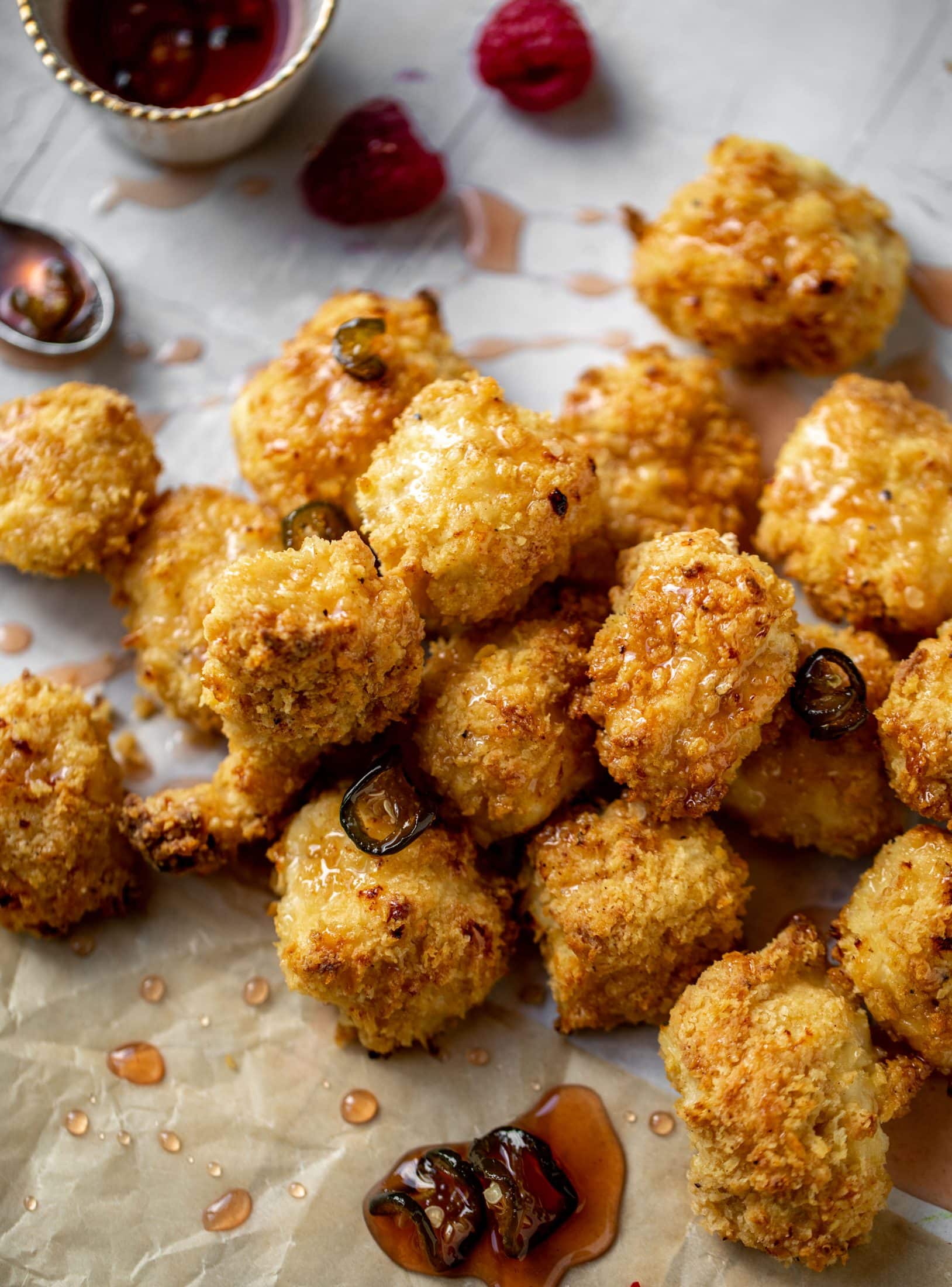 baked popcorn chicken with raspberry hot honey