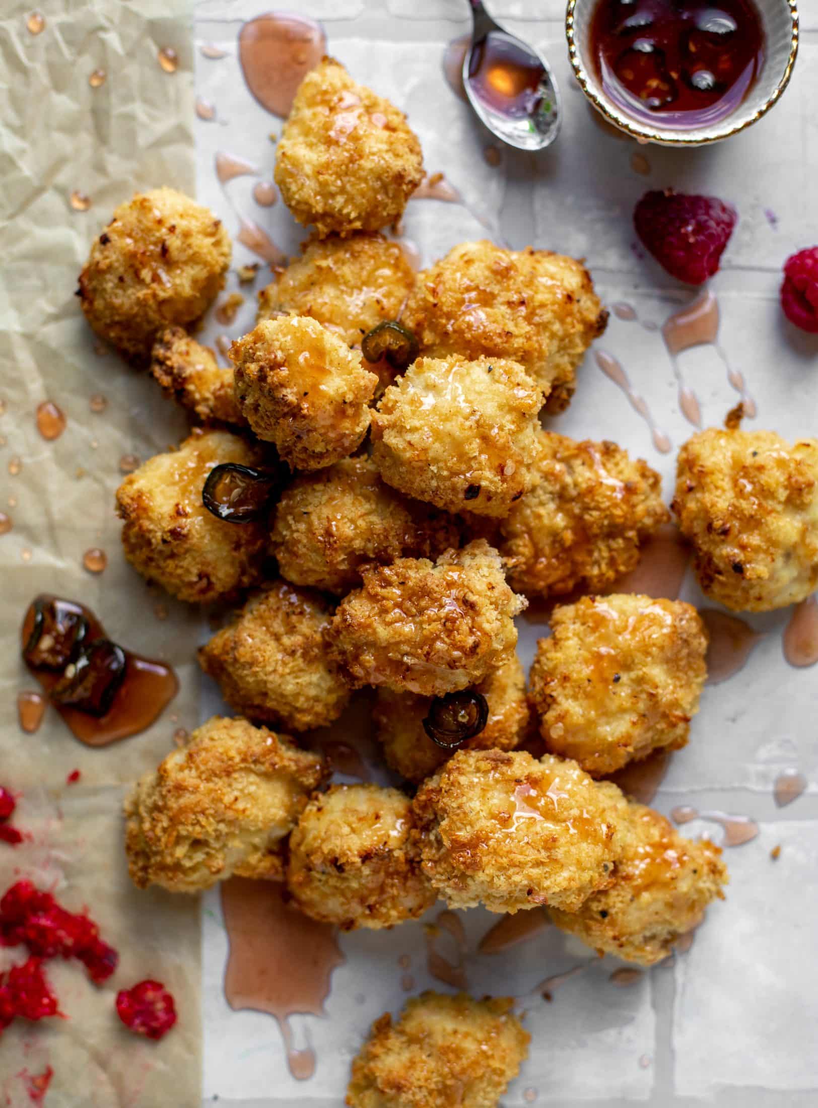 baked popcorn chicken with raspberry hot honey