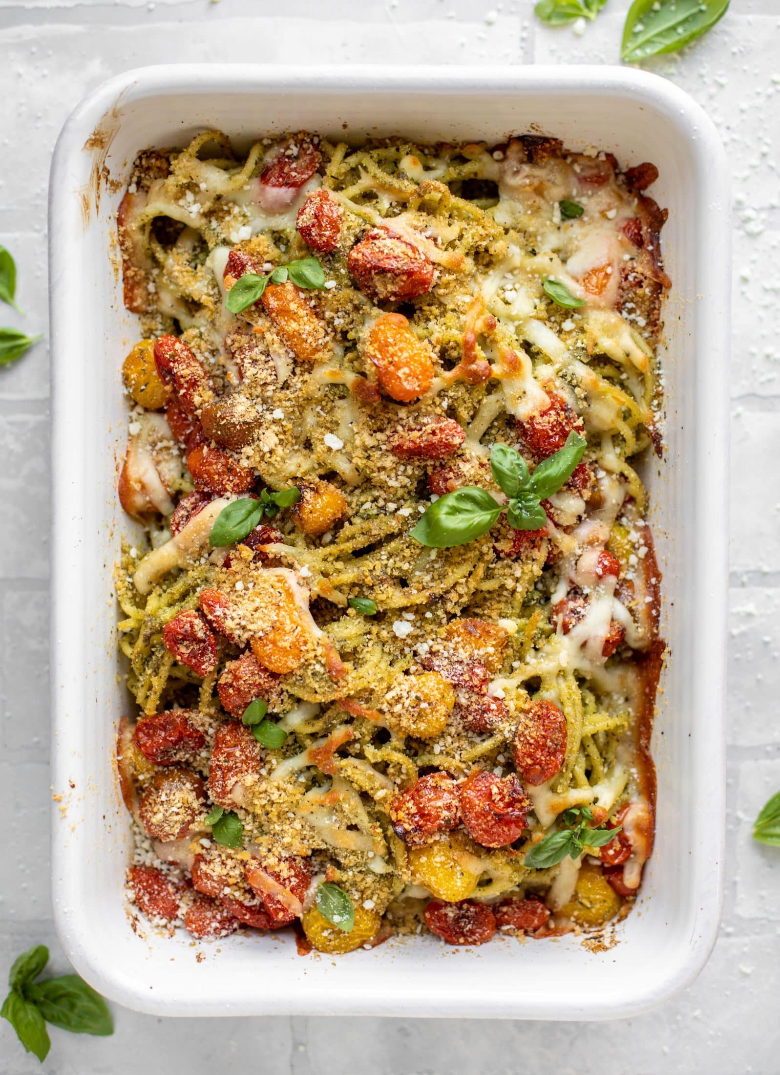 baked pesto bucatini with burst tomatoes