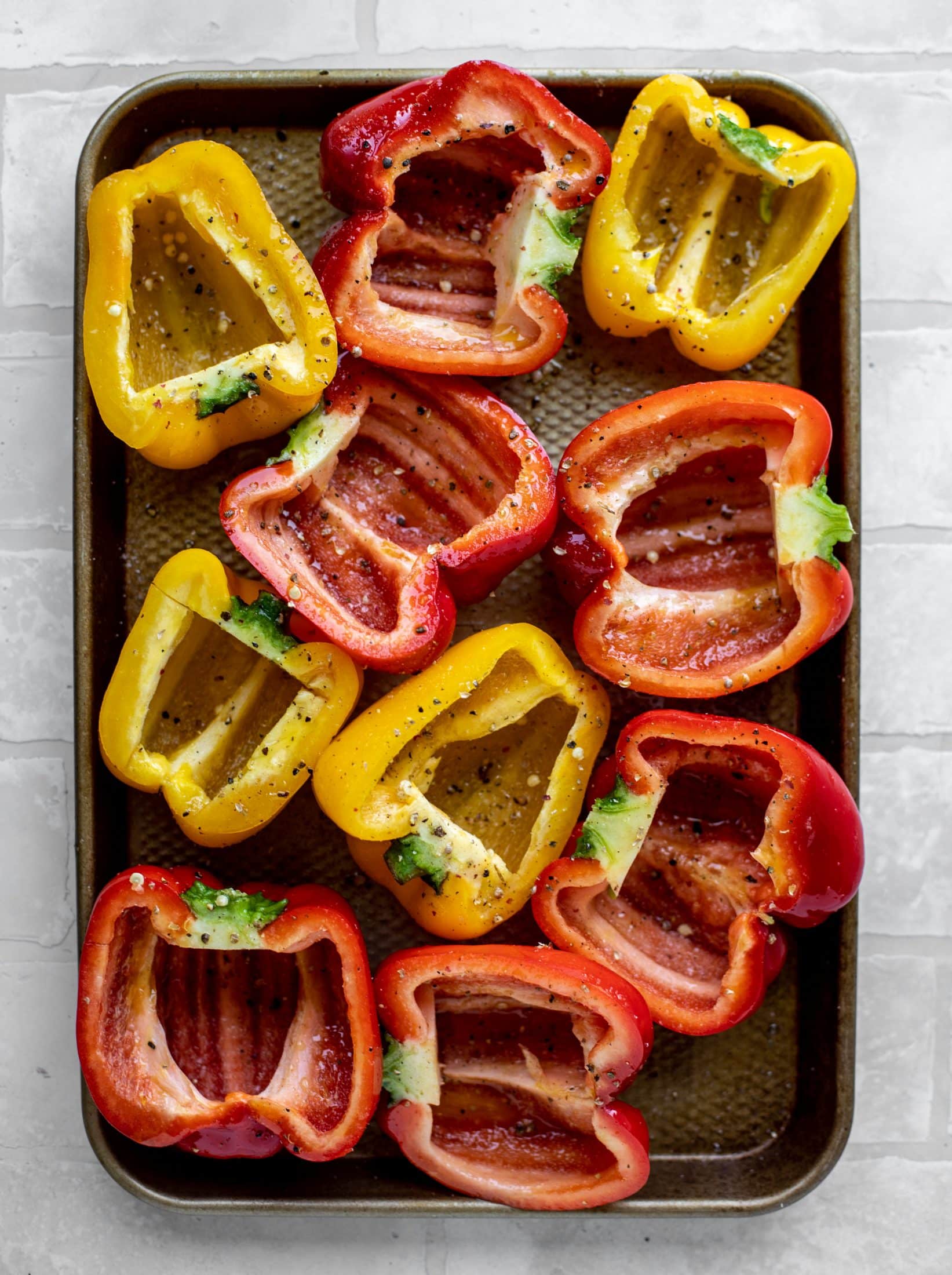 halved bell peppers ready for the grill