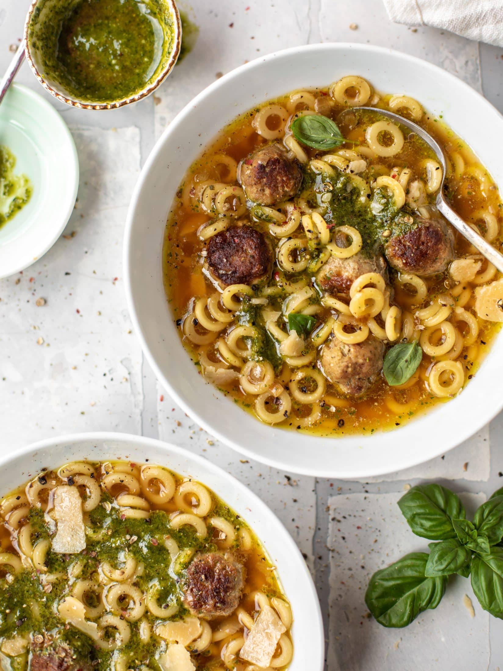 summer pesto mini meatball soup with spoon