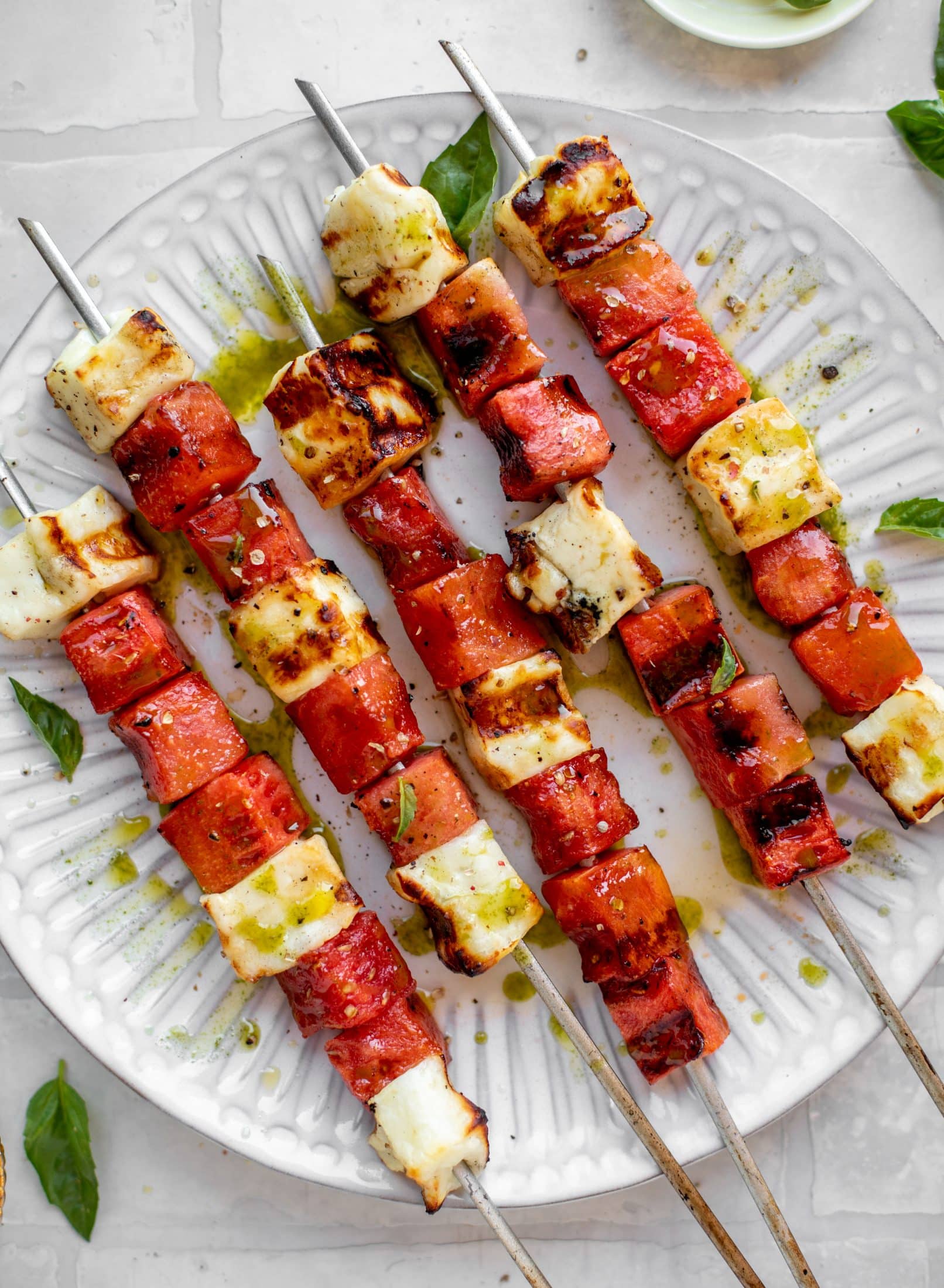 grilled watermelon halloumi skewers with mint basil oil