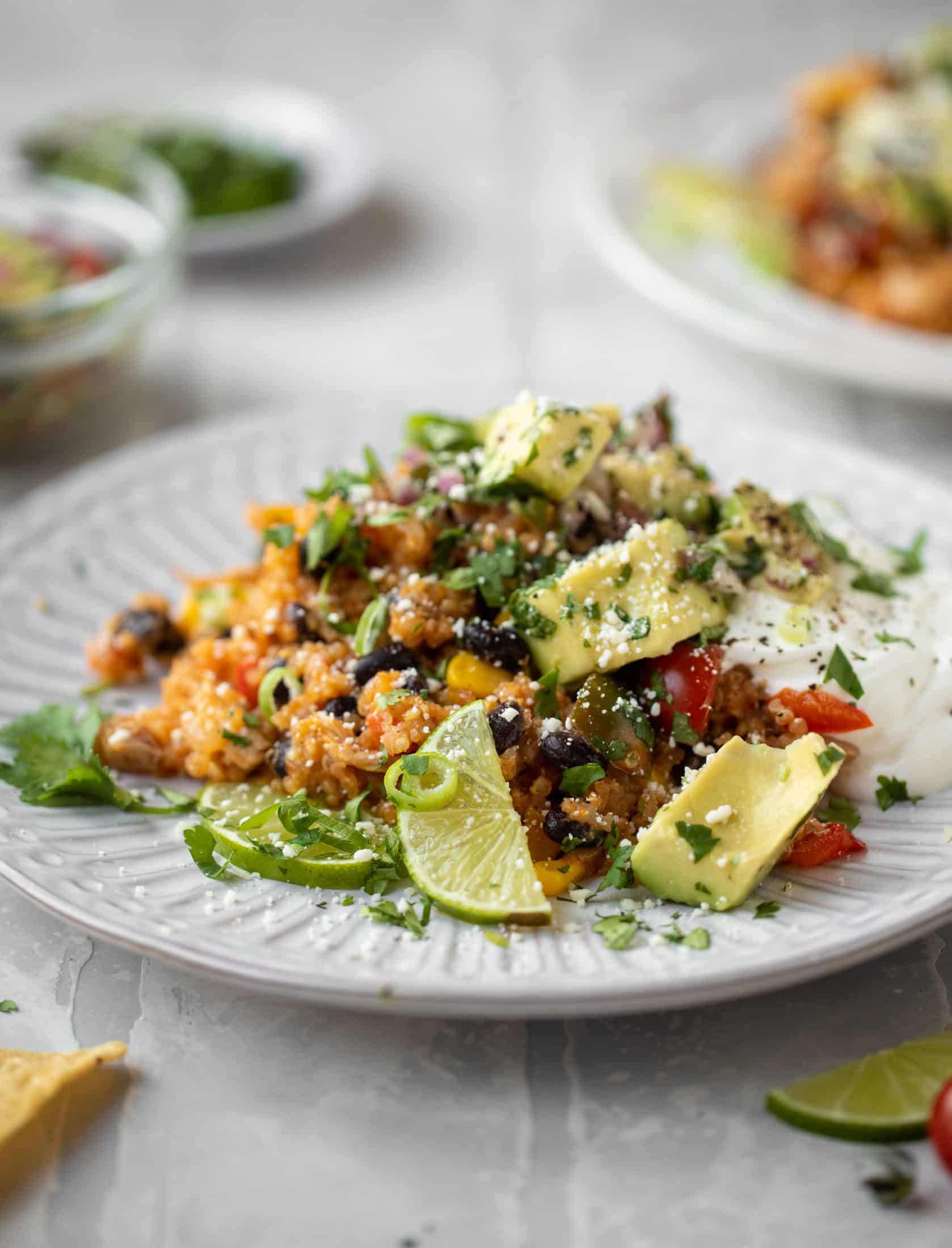 one pot salsa chicken quinoa topped with avocado pico de gallo