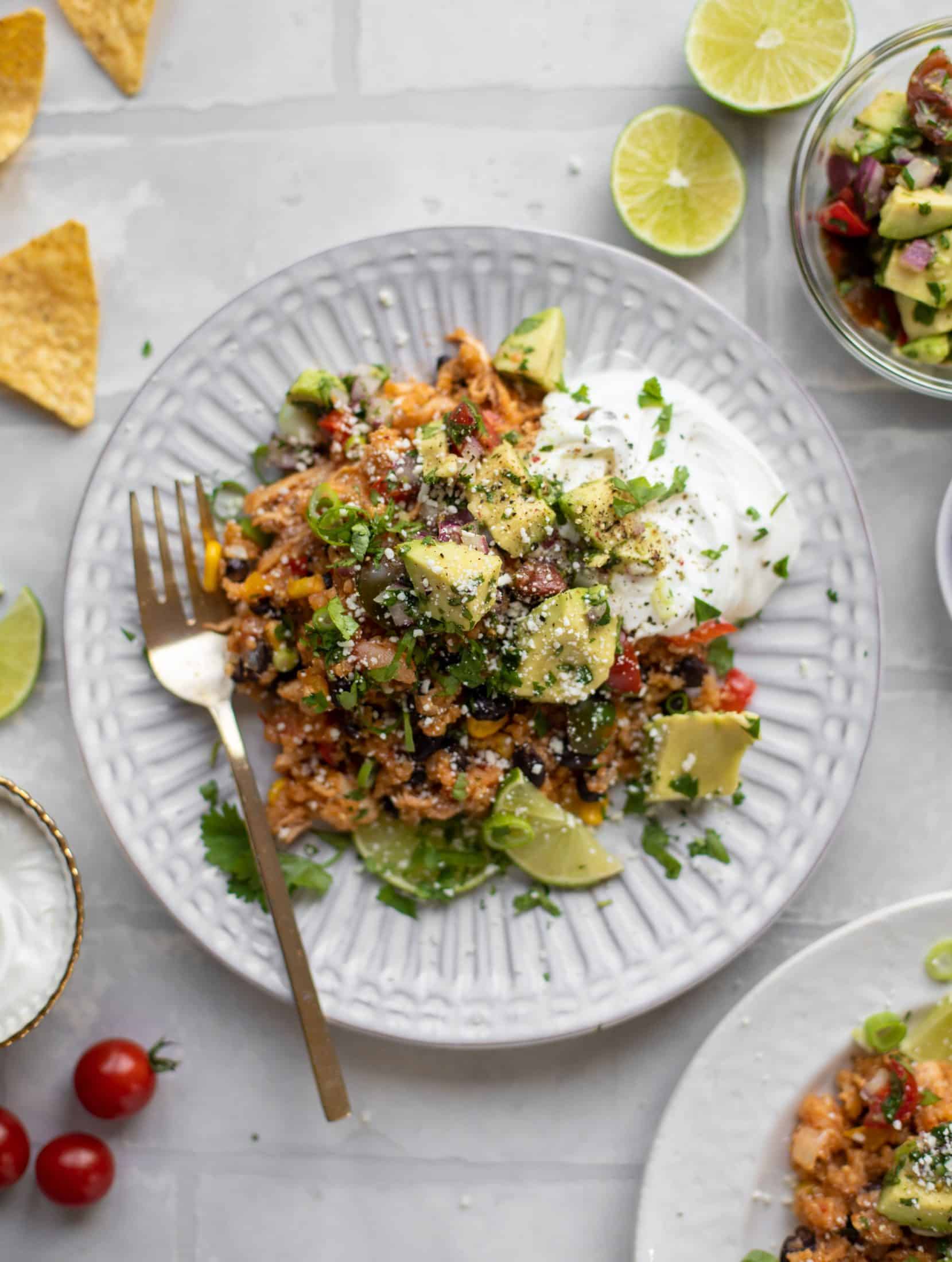 one pot salsa chicken quinoa topped with avocado pico de gallo