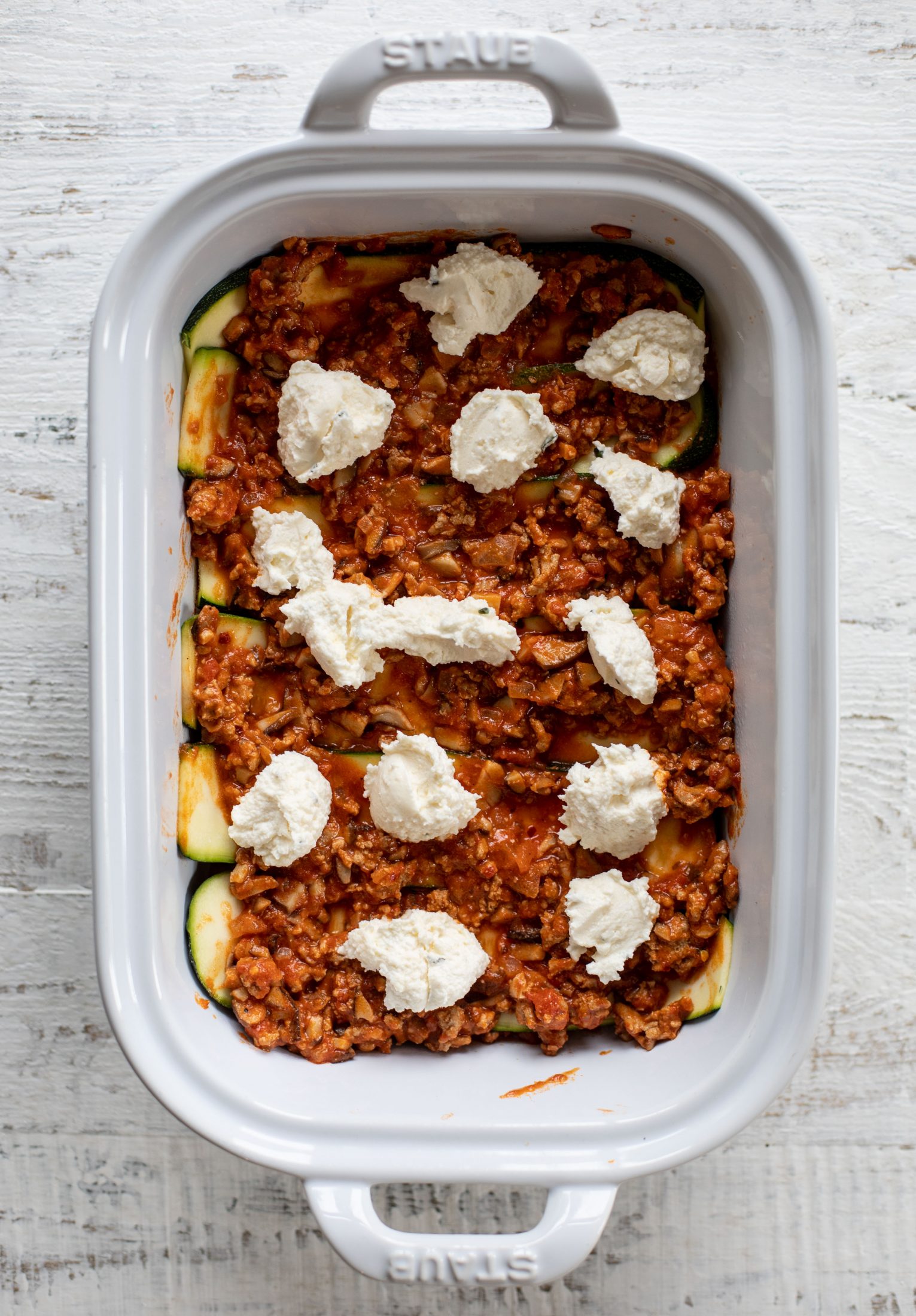 layering the zucchini lasagna bolognese