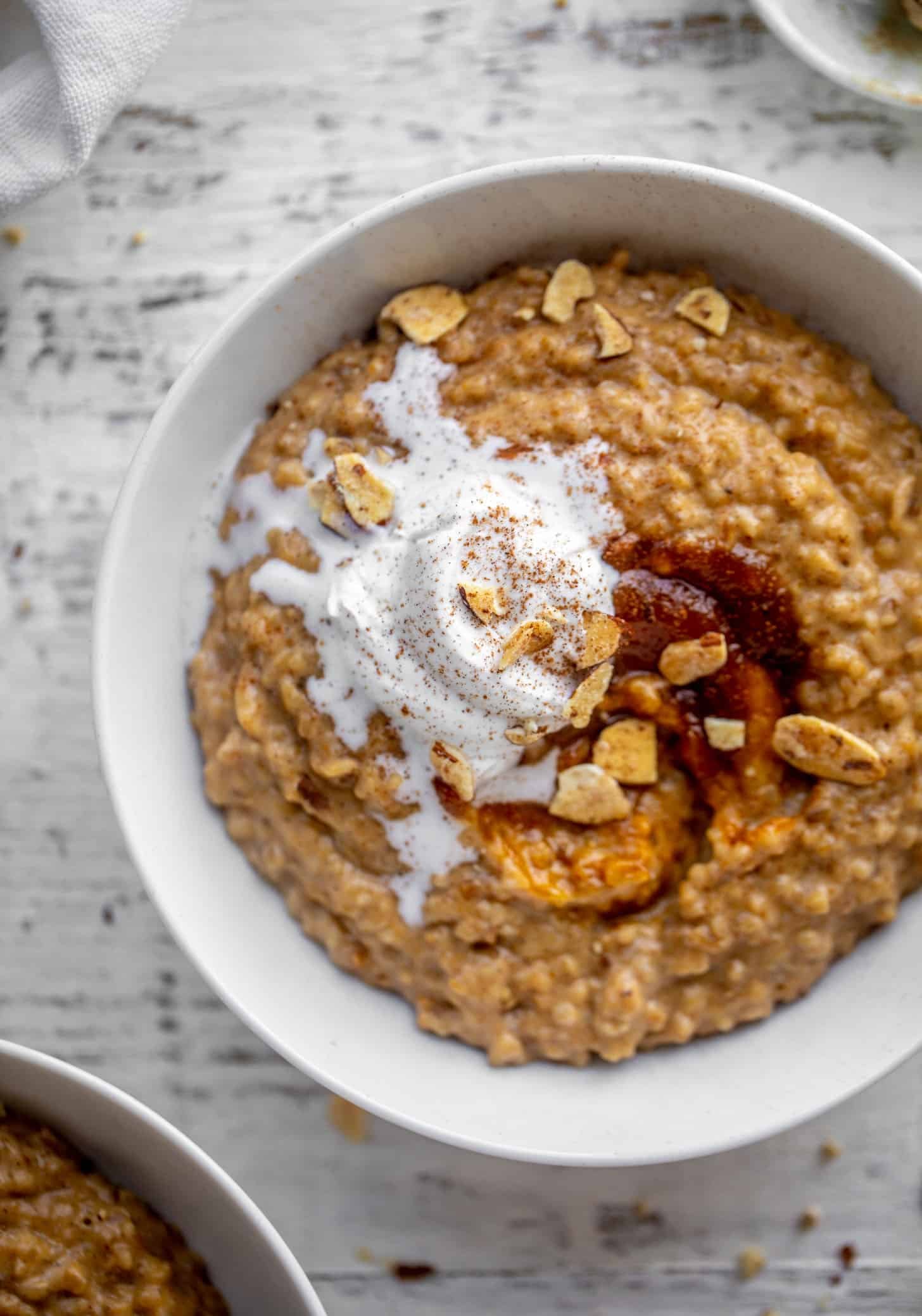 pumpkin pie oatmeal with coconut cream and almonds