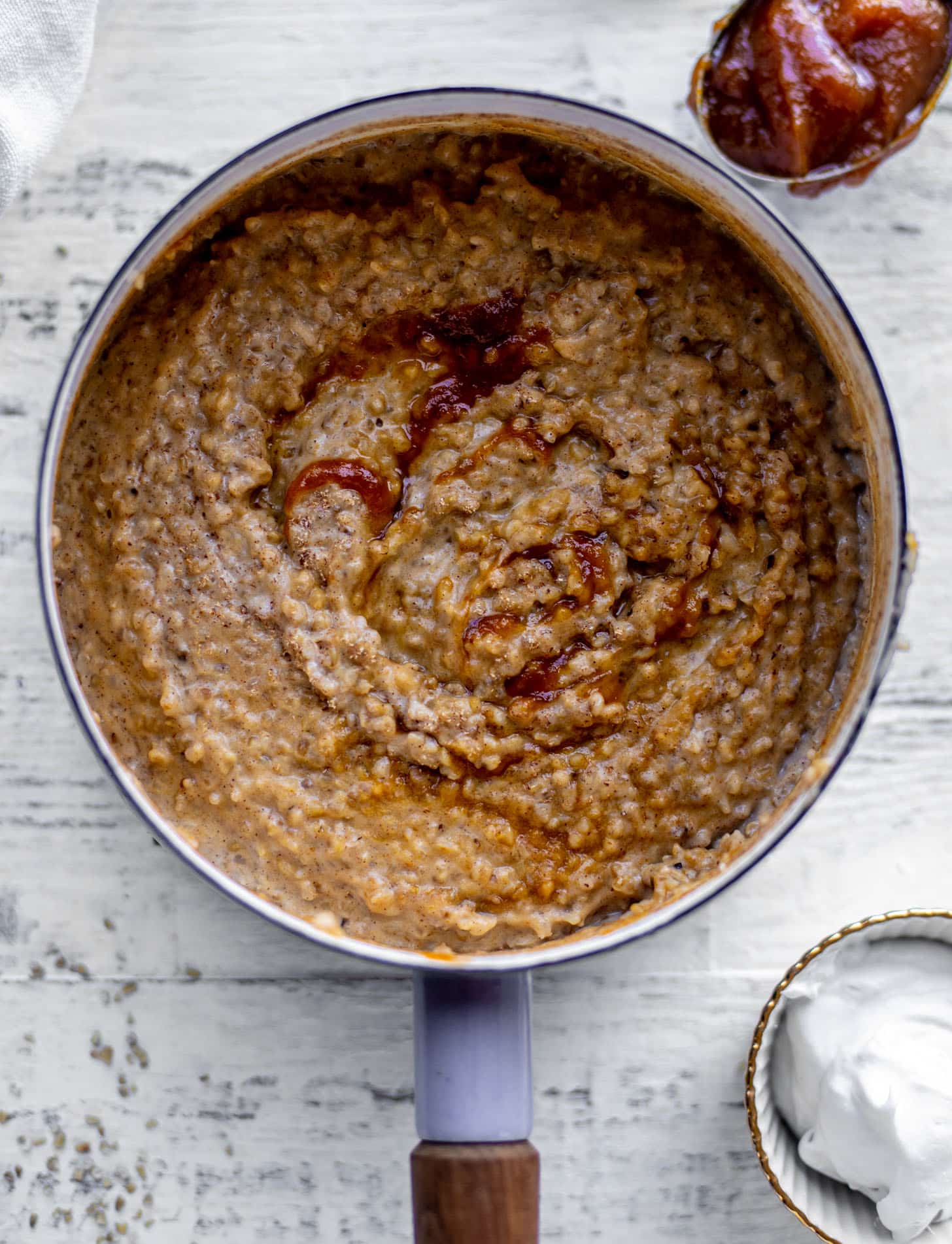 pumpkin pie oatmeal with coconut cream and almonds