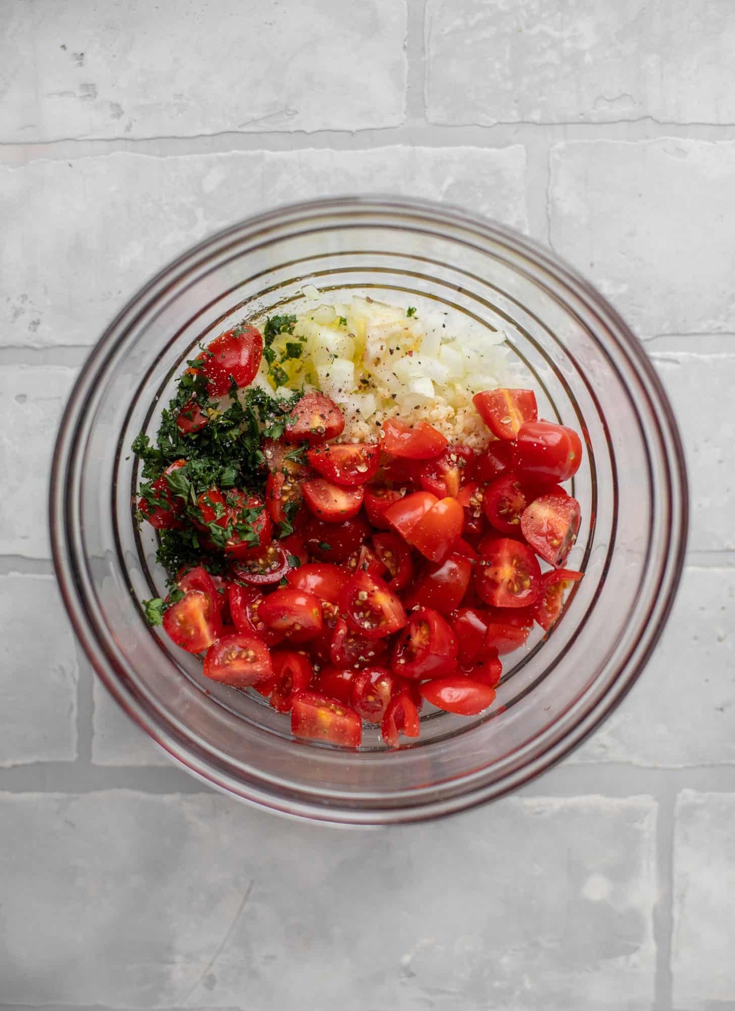 tomatoes, basil, onion, garlic in a bowl