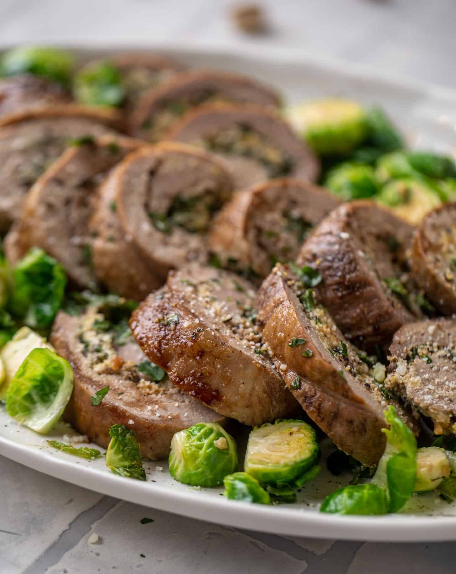 parmesan pistachio stuffed pork tenderloin with brussels sprouts