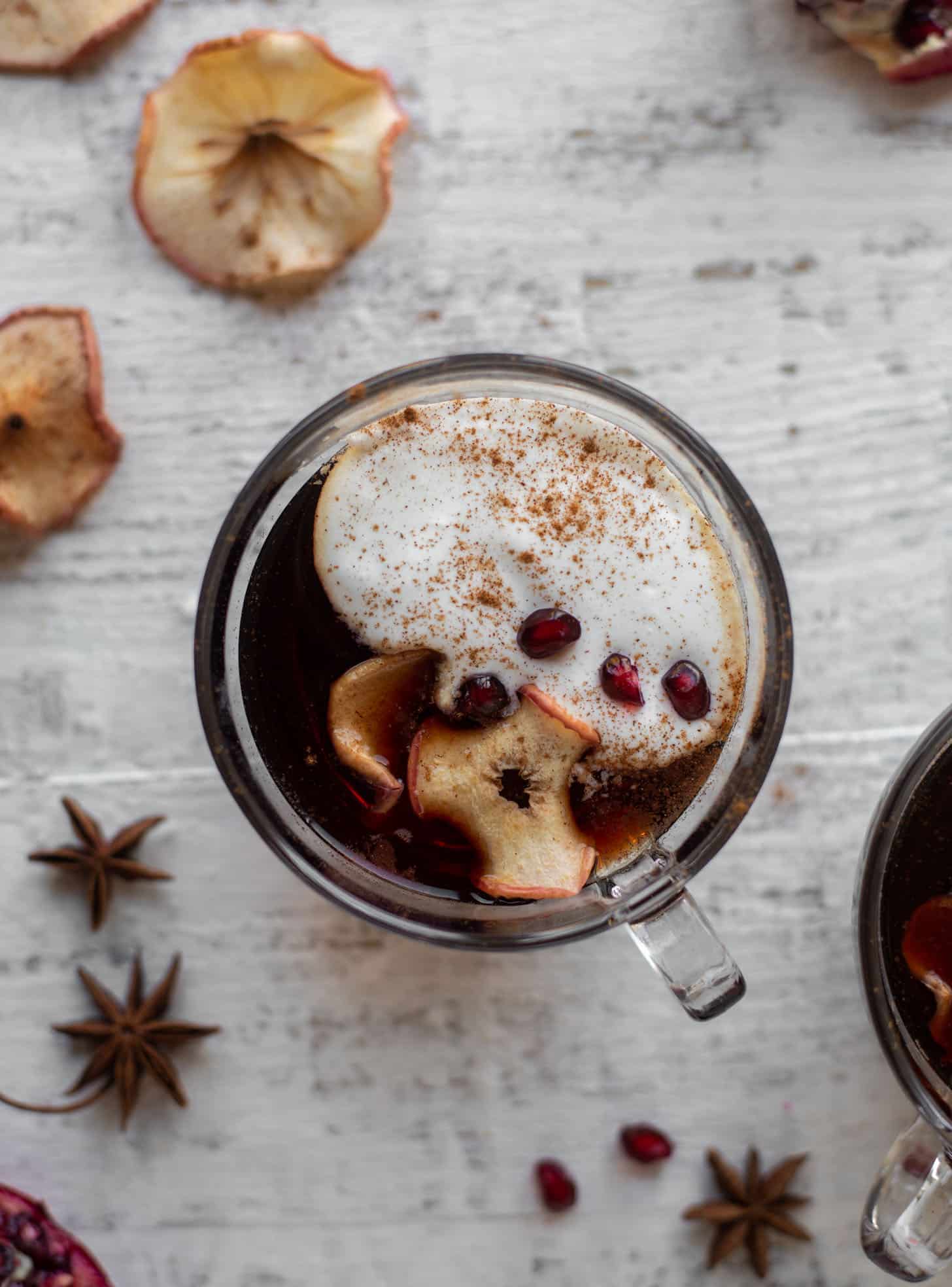 hot pomegranate cider with whipped cream