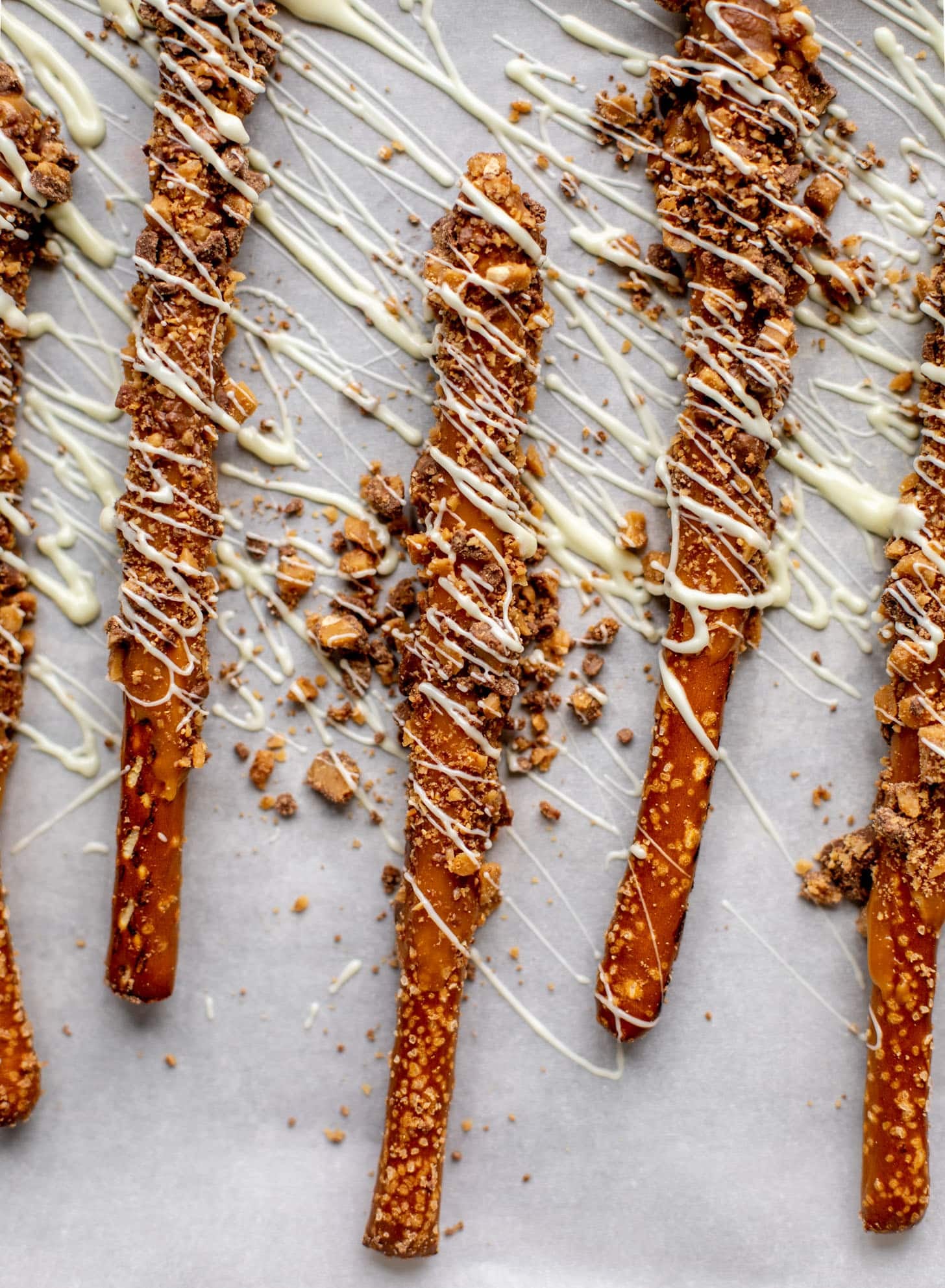 caramel pretzels drizzled with white chocolate