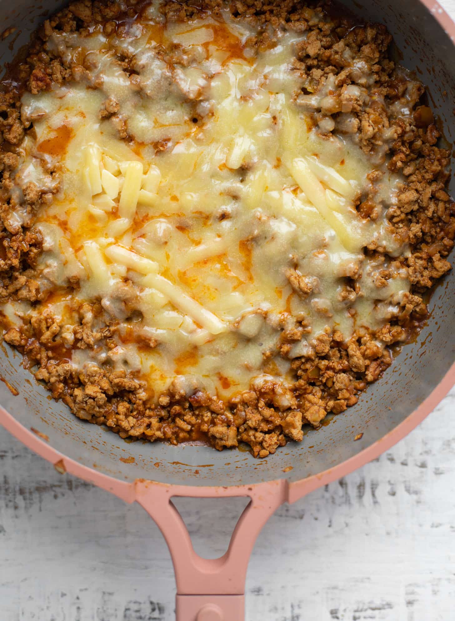 turkey taco meat with melted cheddar
