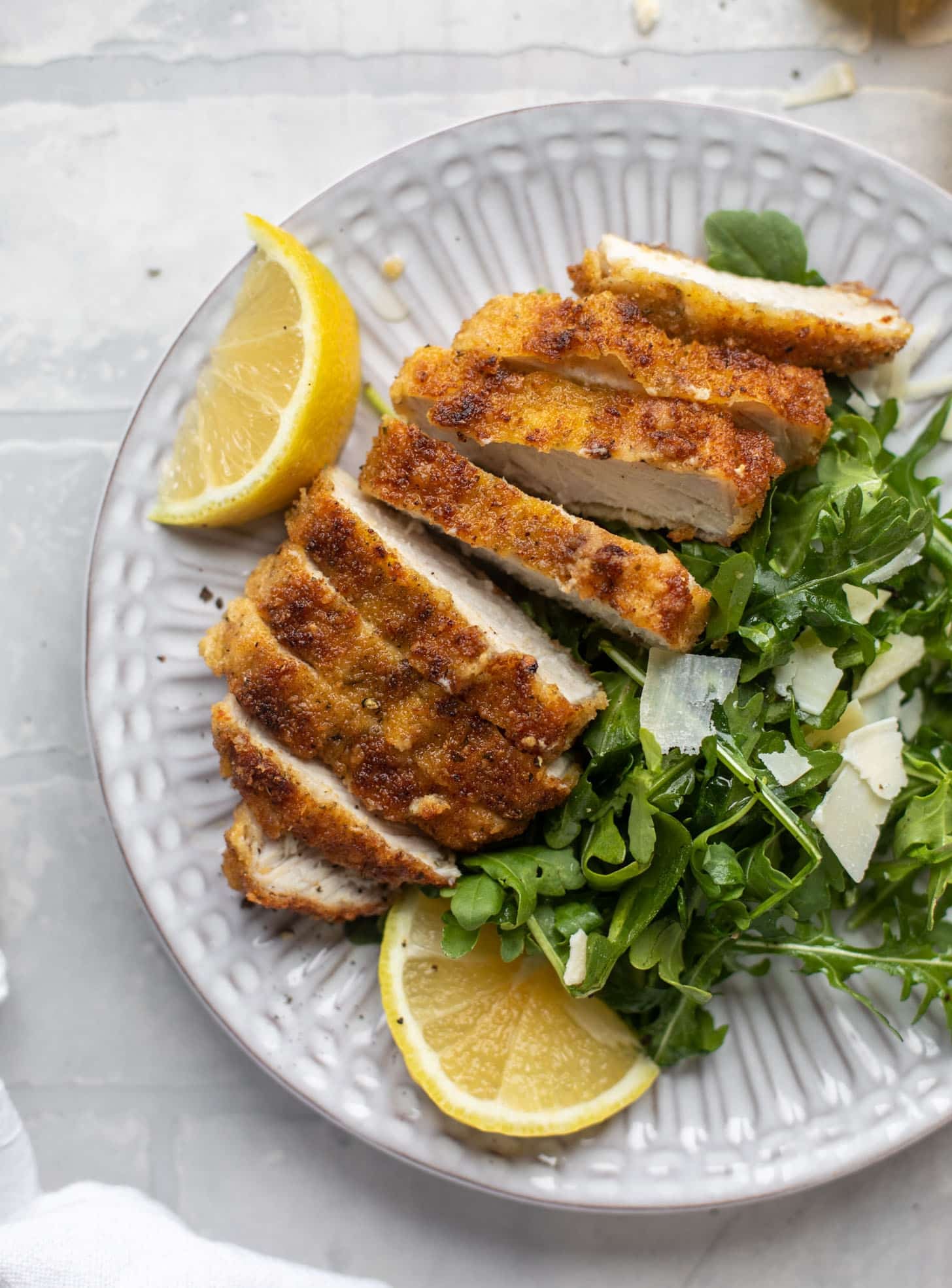 pork milanese with lemon arugula greens