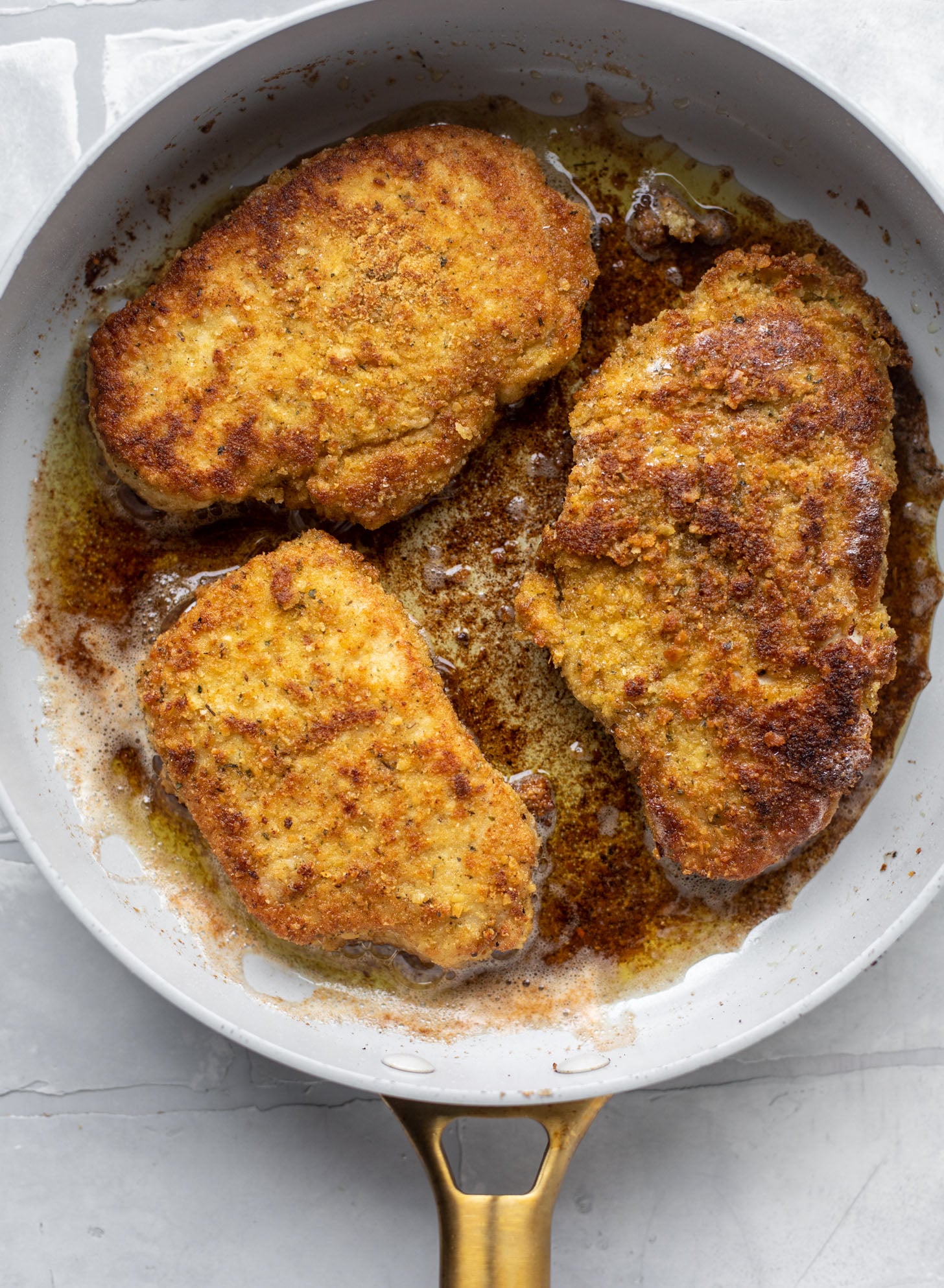crispy pork milanese in a skillet