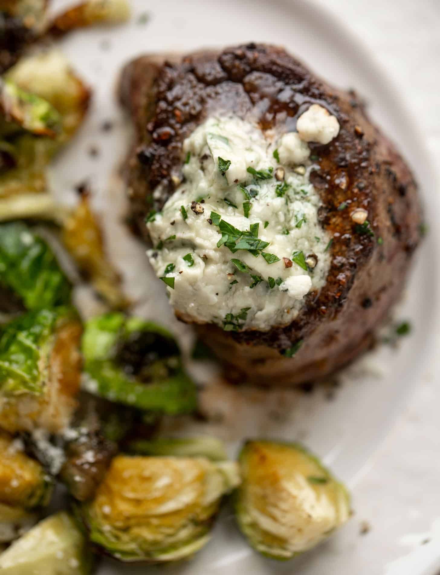 filet mignon with blue cheese butter and cacio e pepe brussels