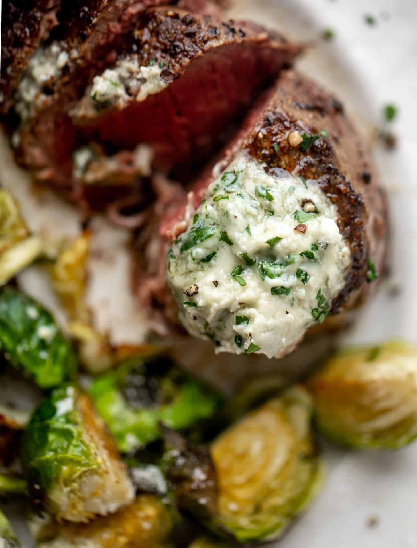 filet mignon with blue cheese butter and cacio e pepe brussels
