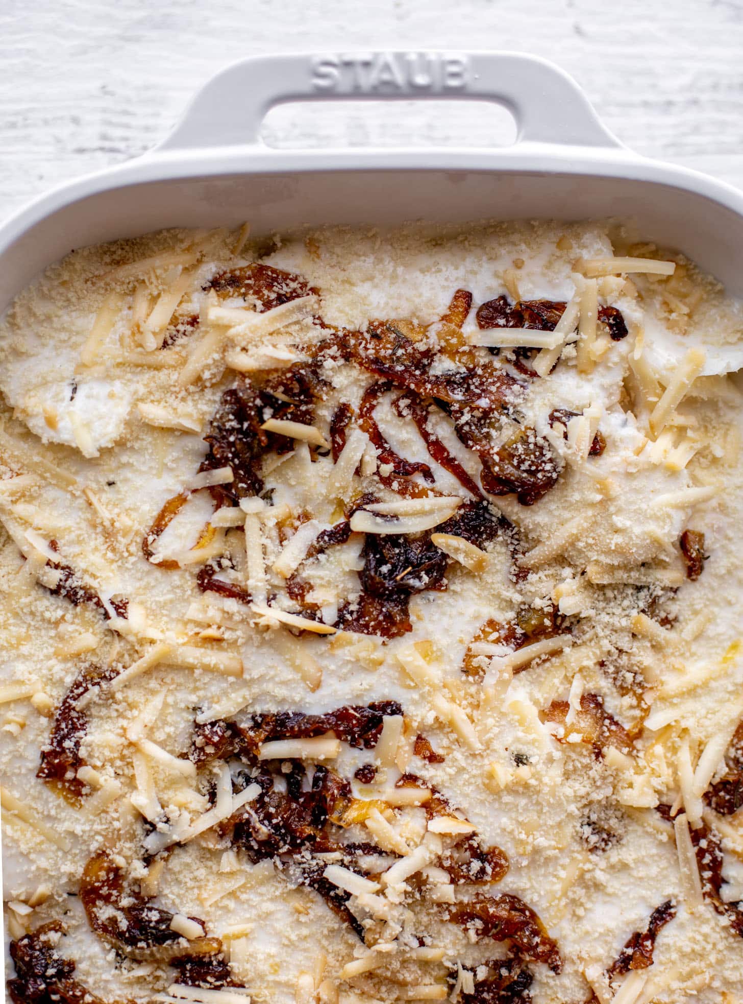 layer potatoes, gruyere, caramelized onions