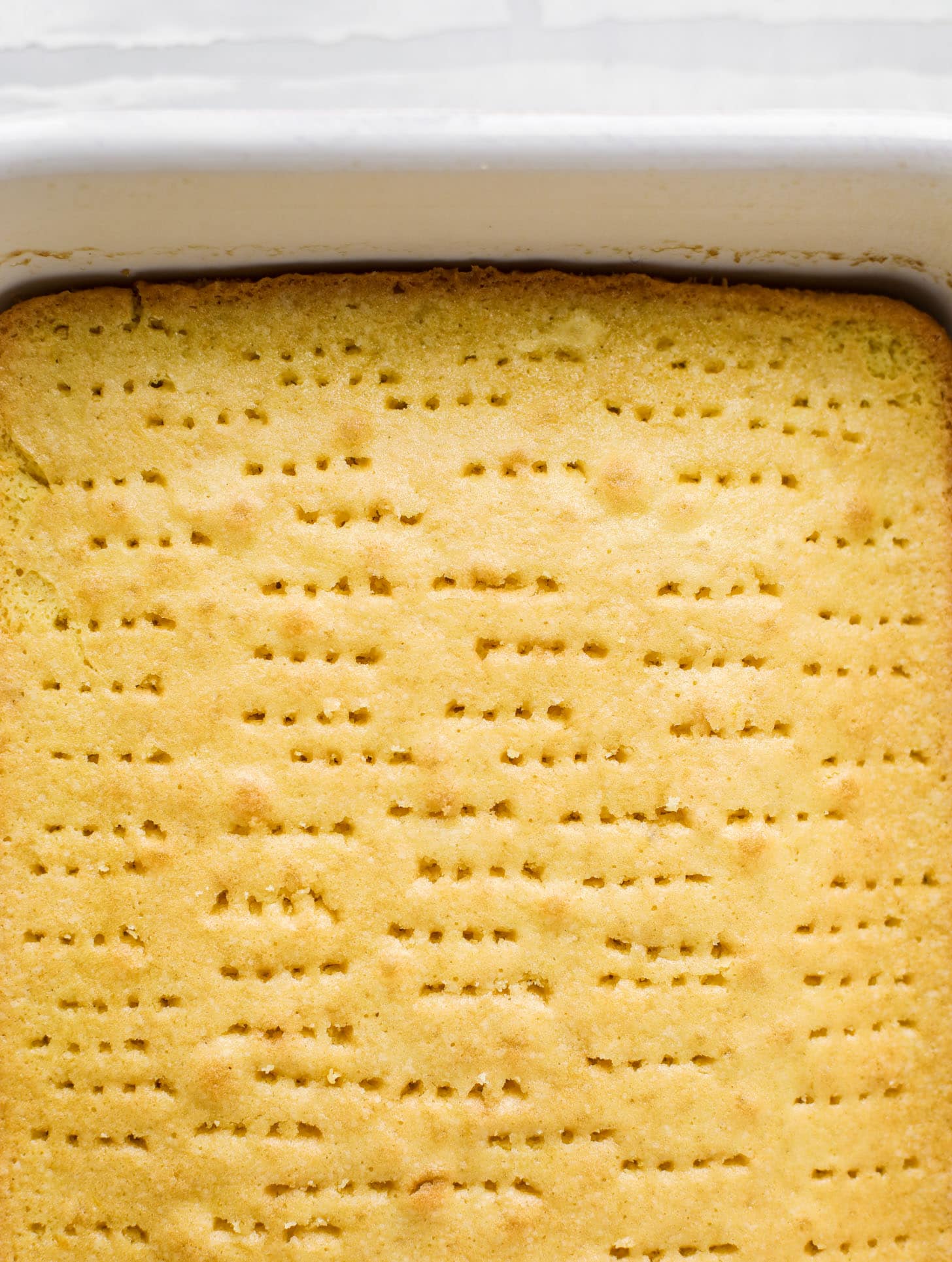 tres leches cake with holes poked in it