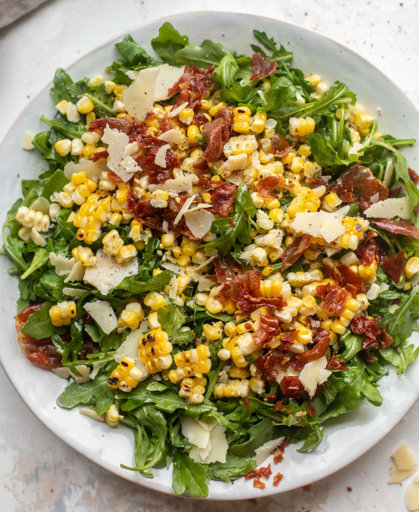 crispy prosciutto & charred corn arugula salad