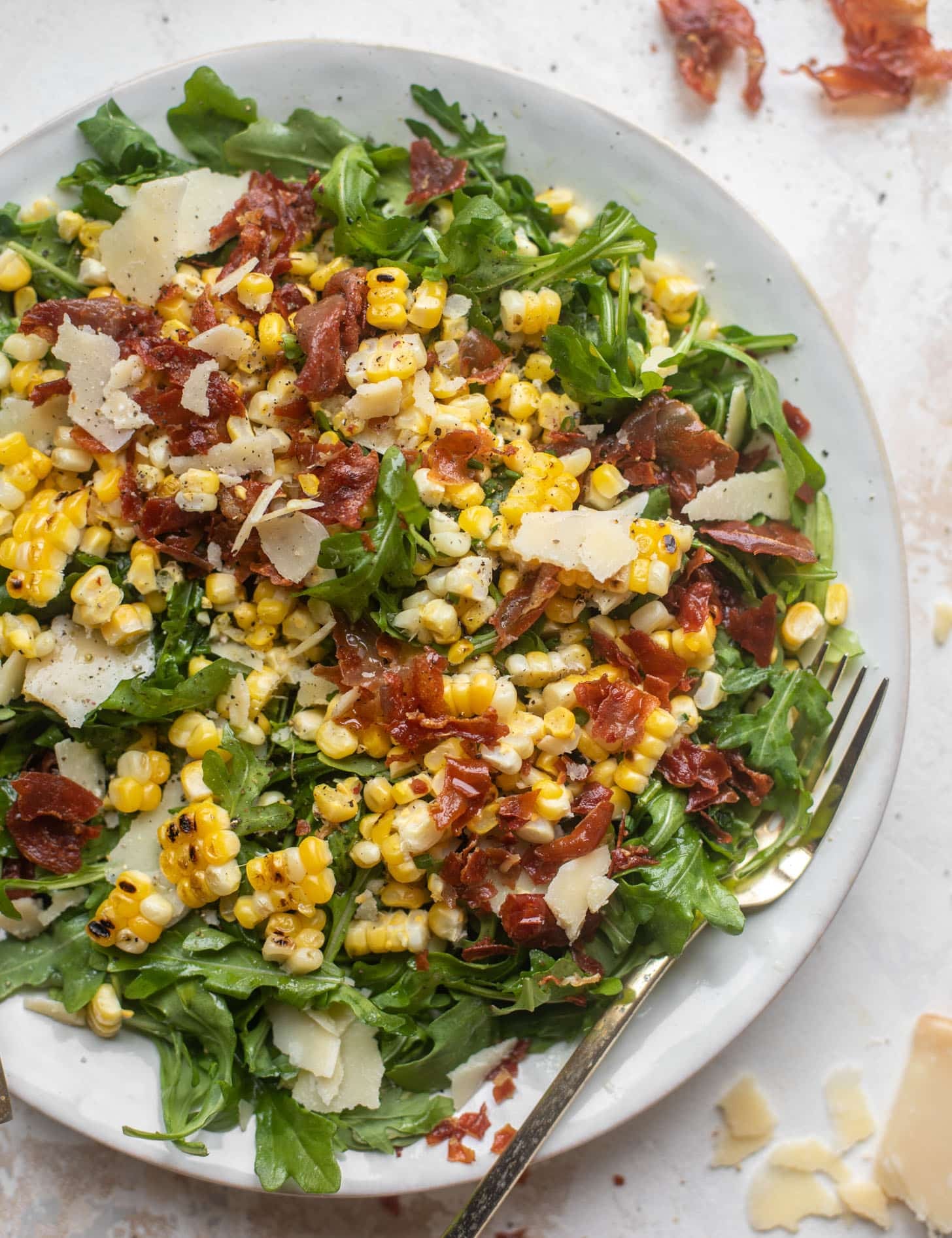 crispy prosciutto & charred corn arugula salad