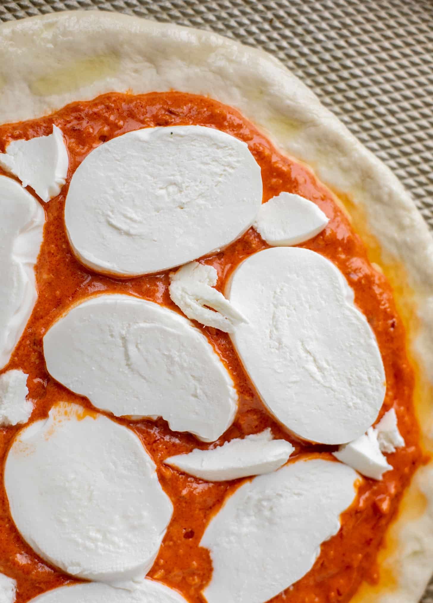 dough with sauce and cheese