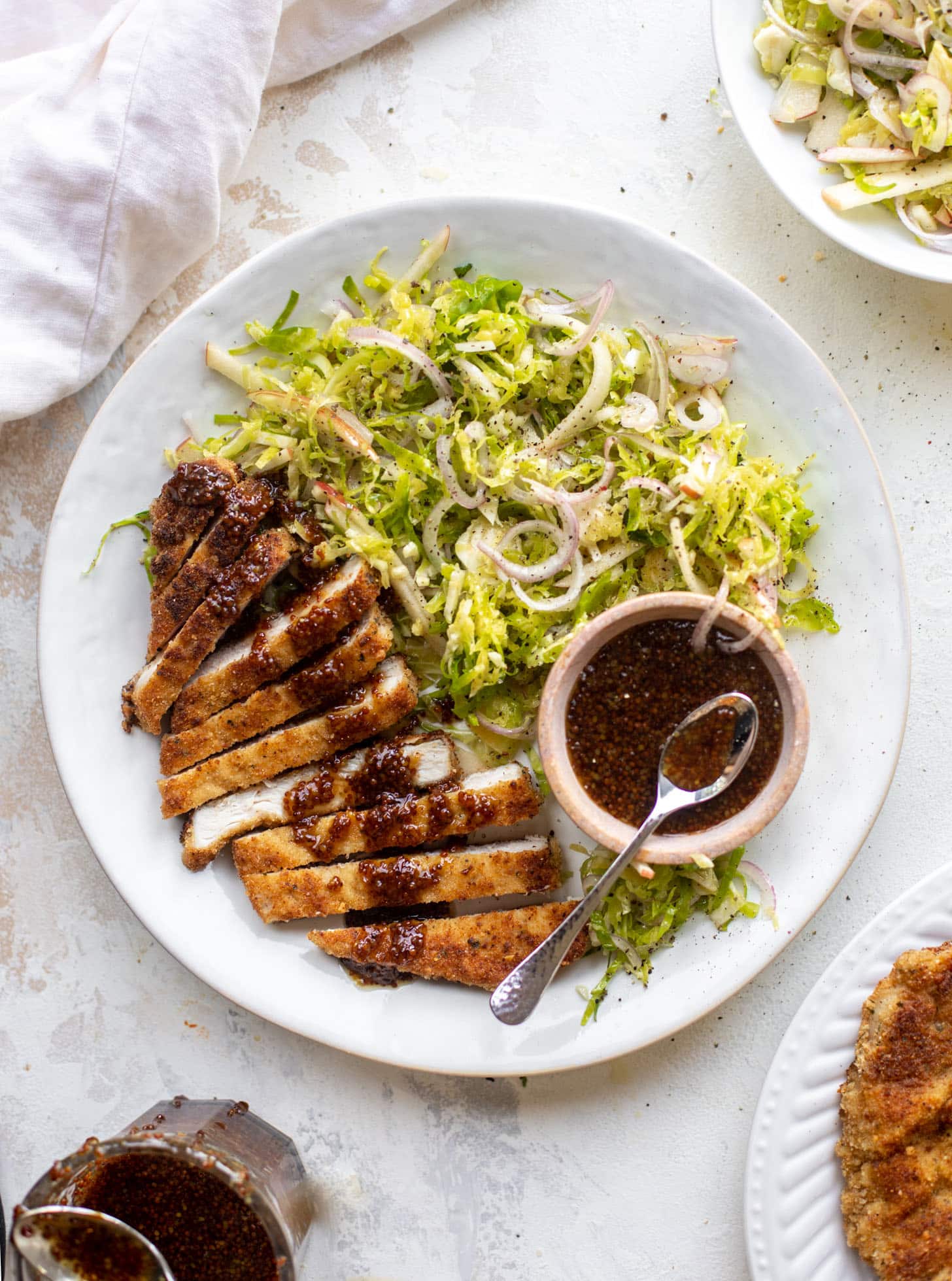 pork schnitzel with carolina gold BBQ sauce & brussels sprouts slaw
