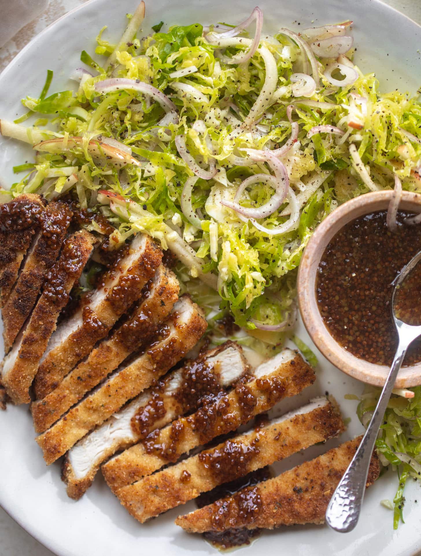 pork schnitzel with carolina gold BBQ sauce & brussels sprouts slaw