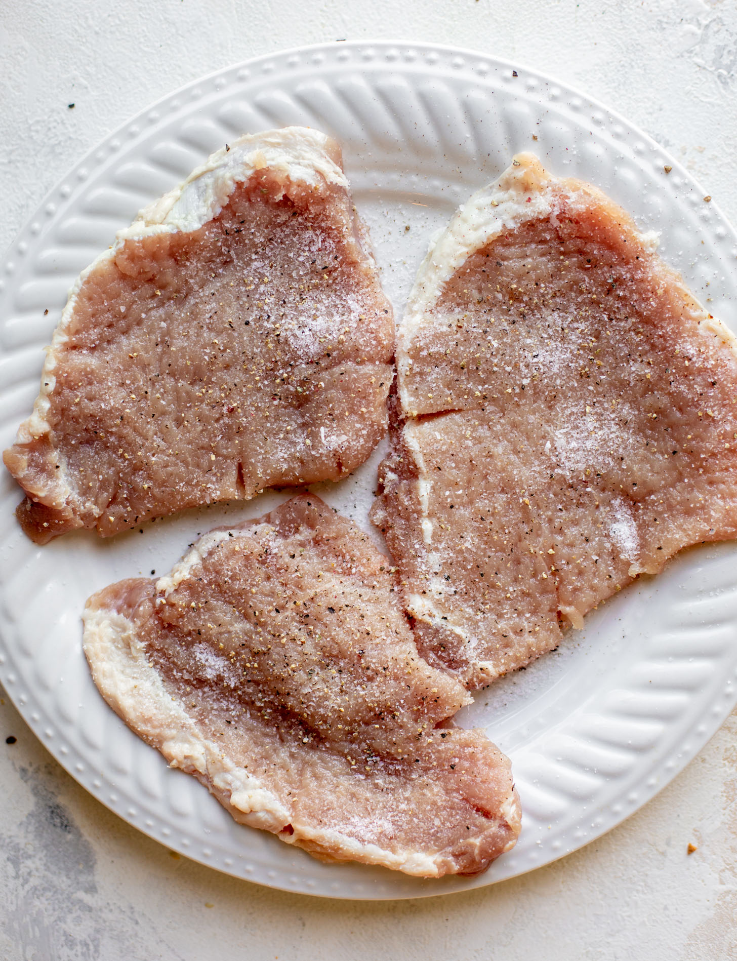 pork chops seasoned with salt and pepper