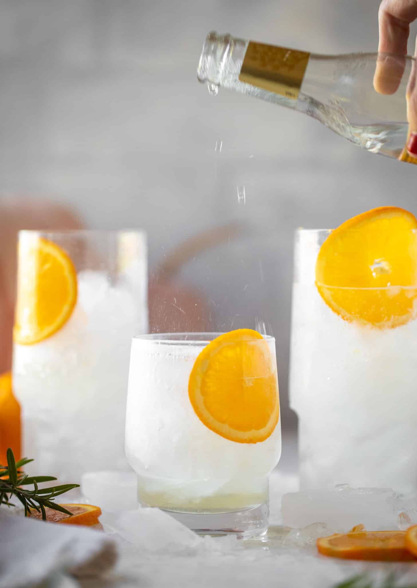 pouring tonic water in