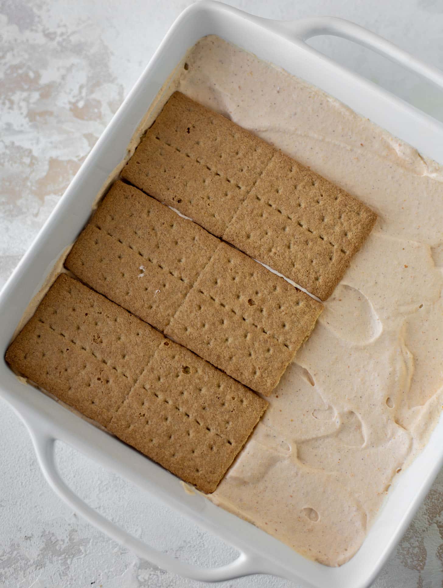 layers of graham crackers on pumpkin cream