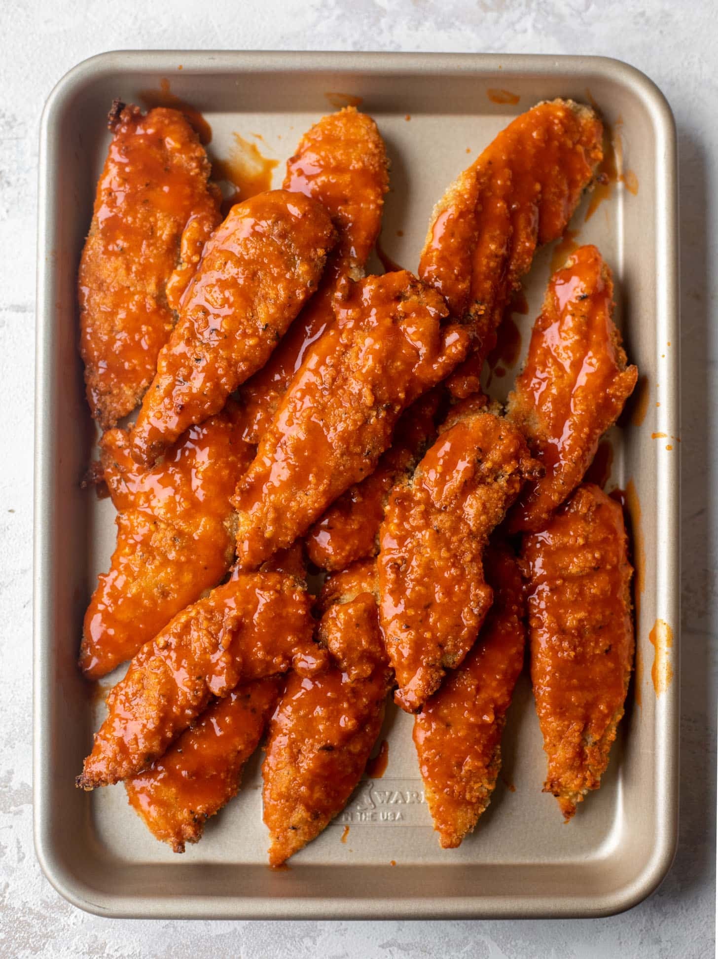 baked buffalo chicken on a sheet pan