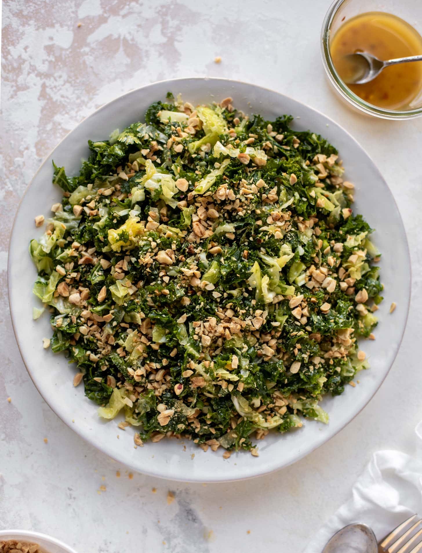 crunchy emerald kale salad with peanut vinaigrette