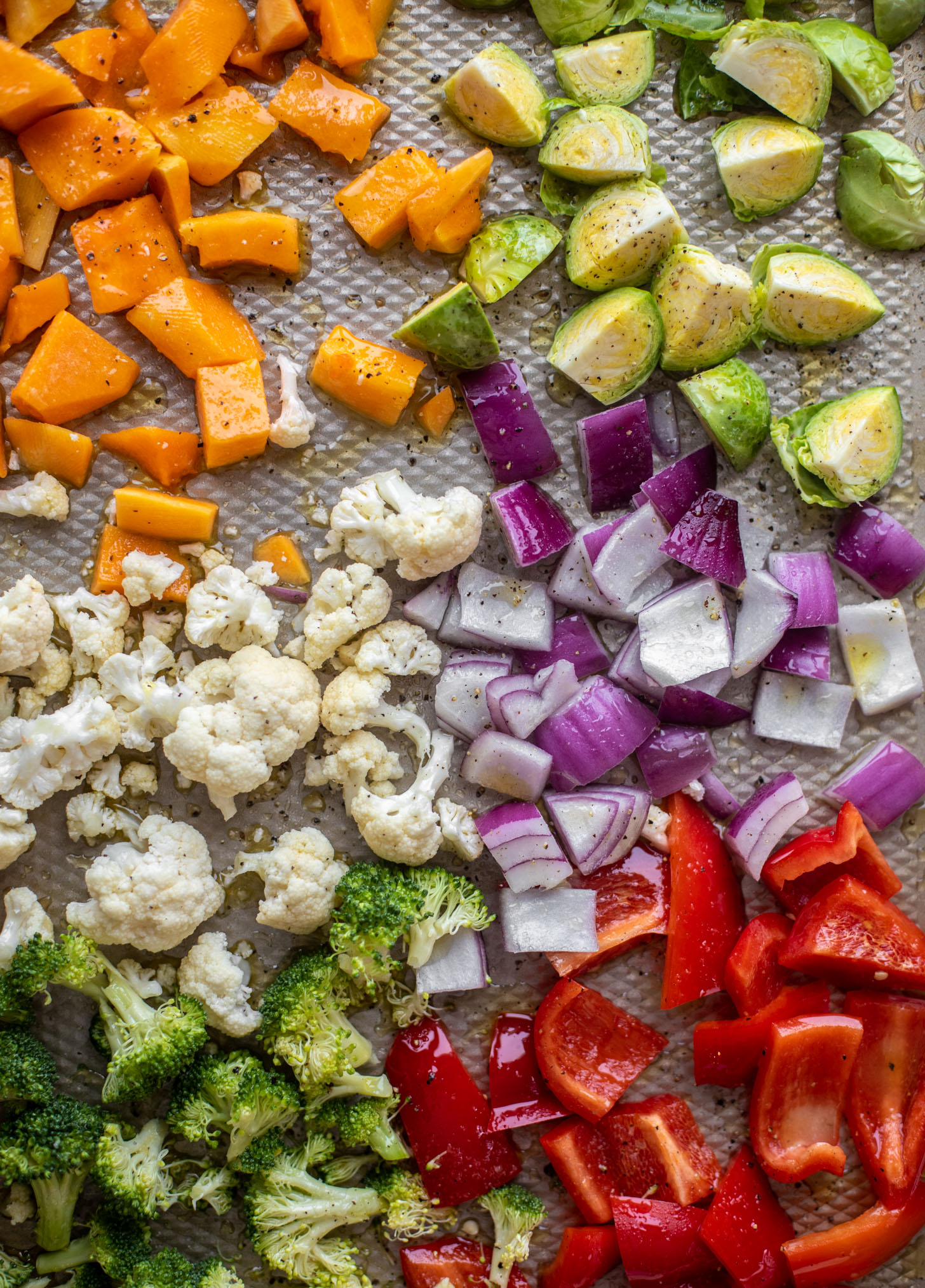 raw vegetables on baking sheet