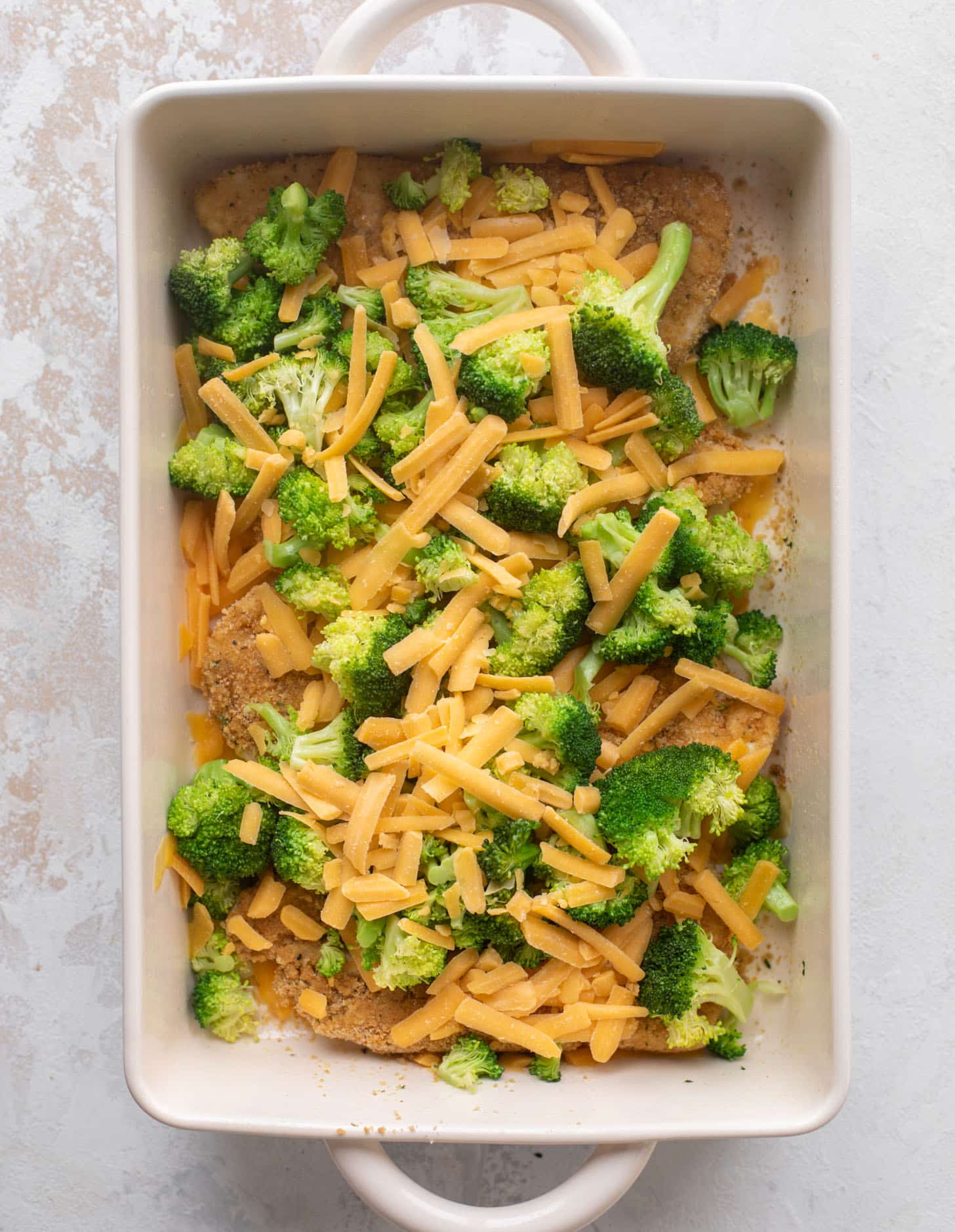 crispy broccoli cheddar melt chicken ready for the oven