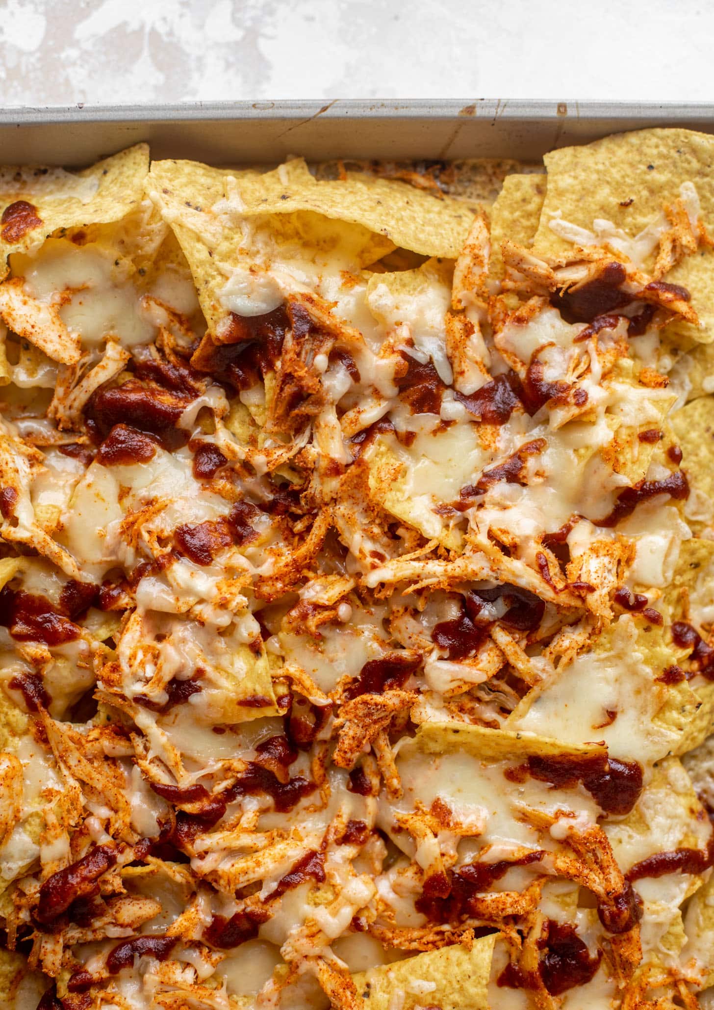 chips with melted cheese, chicken, bbq sauce