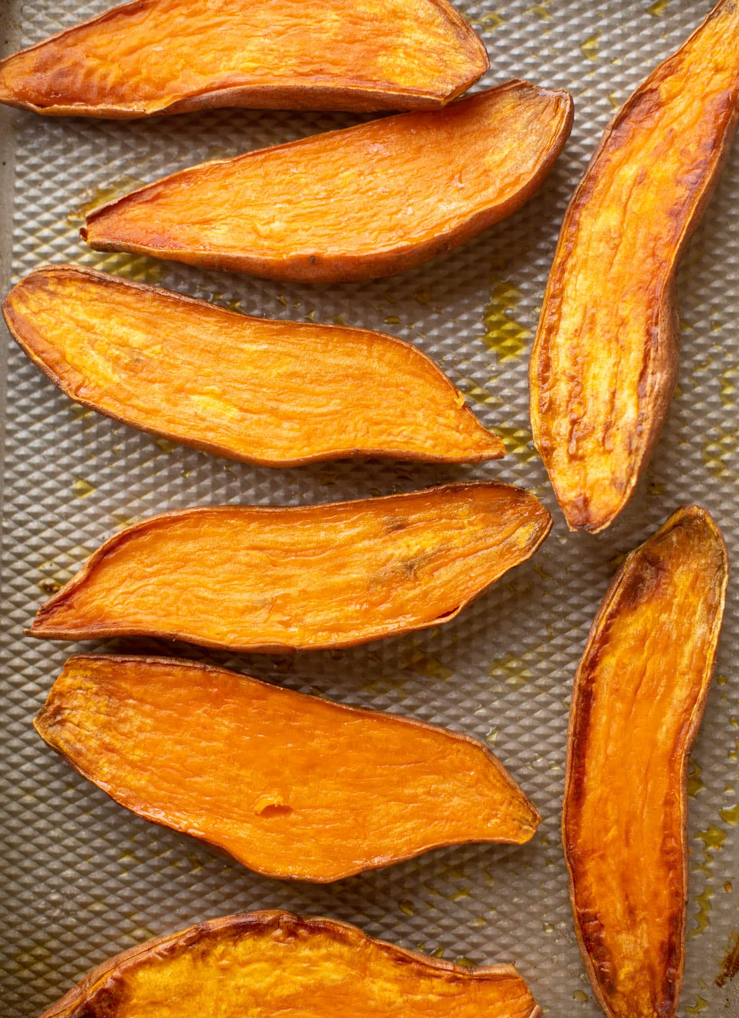 slow roasted sweet potatoes on a baking sheet