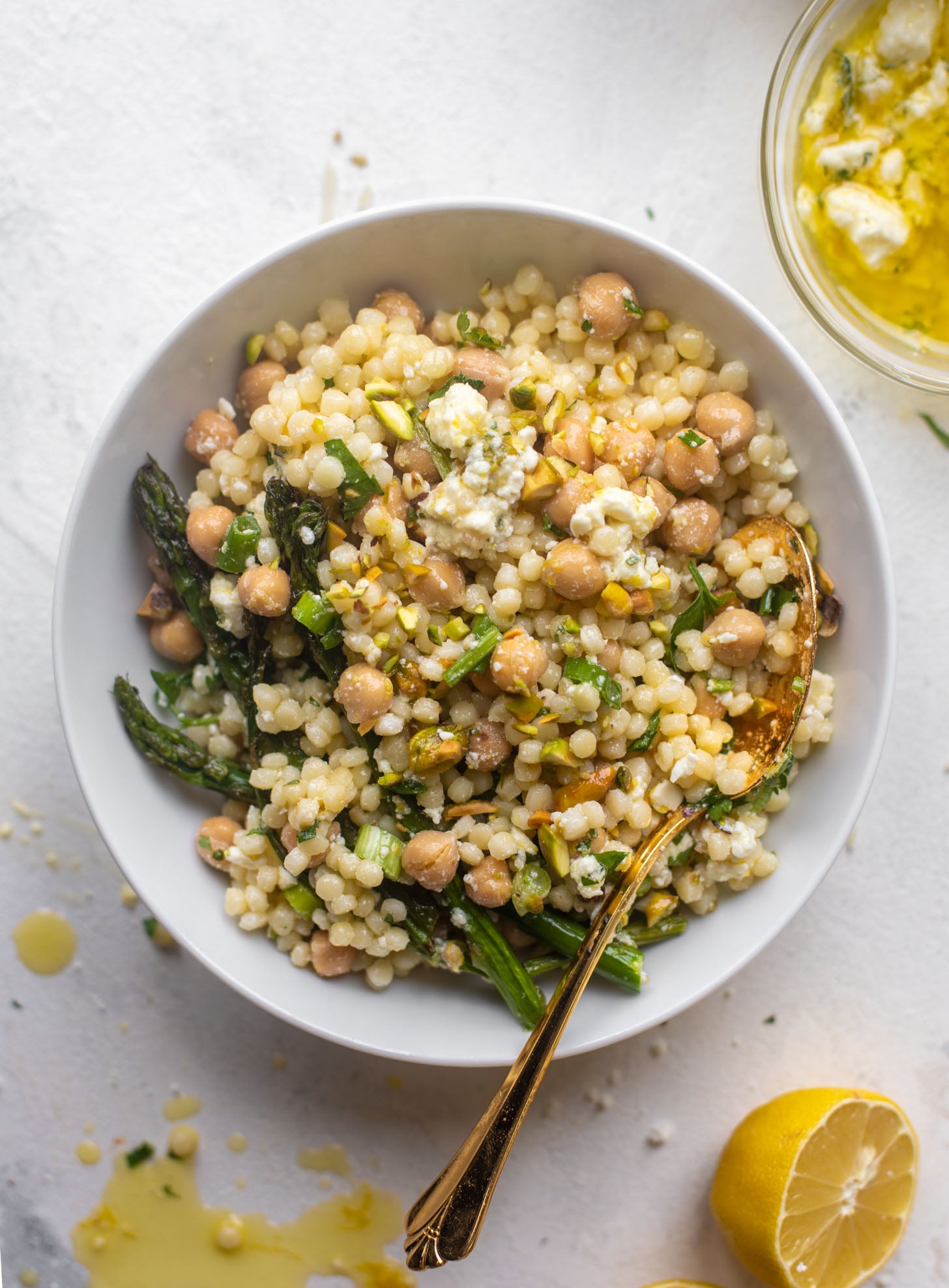 spring couscous bowls with lemon feta vinaigrette