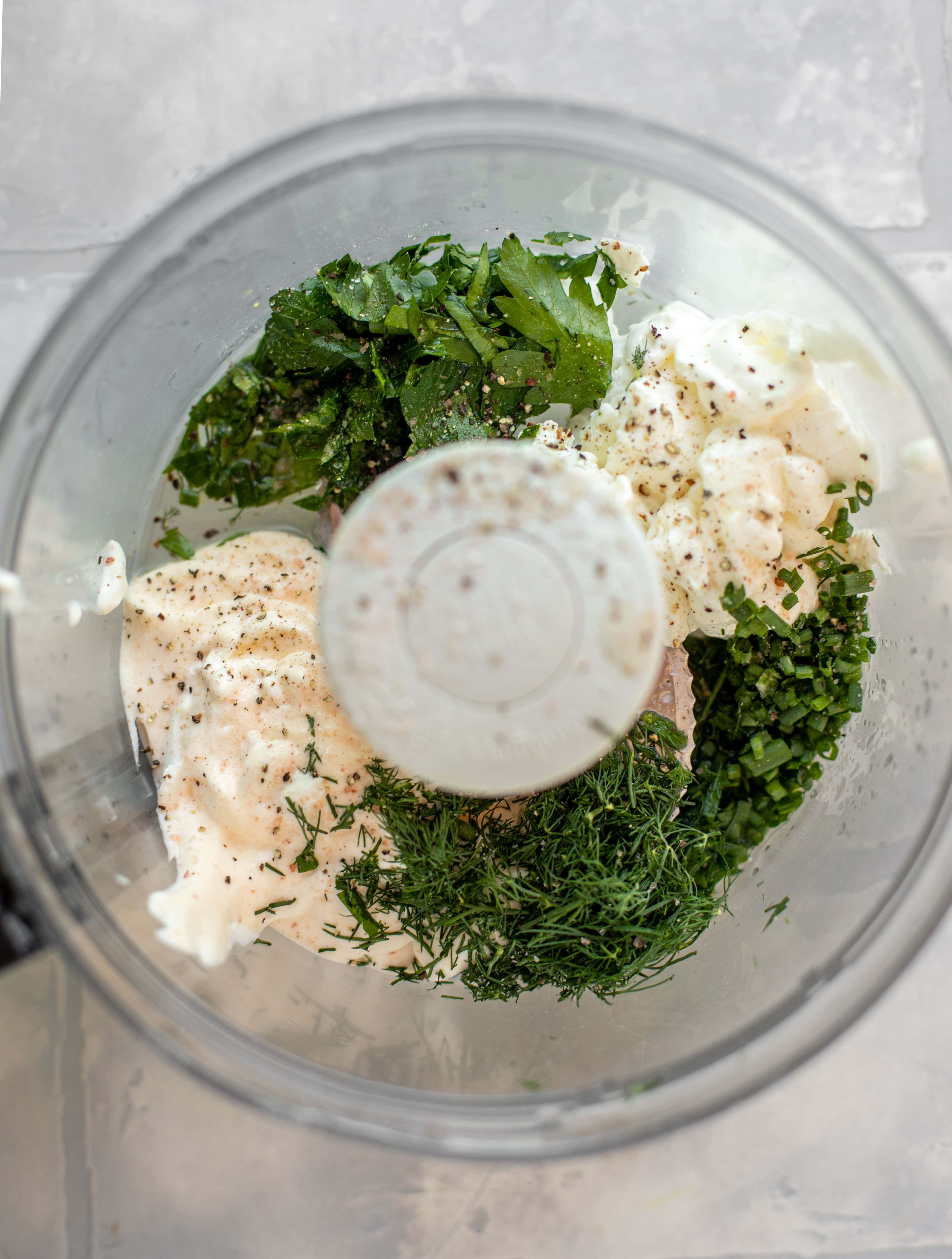 fresh herbs, yogurt, mayo in a food processor