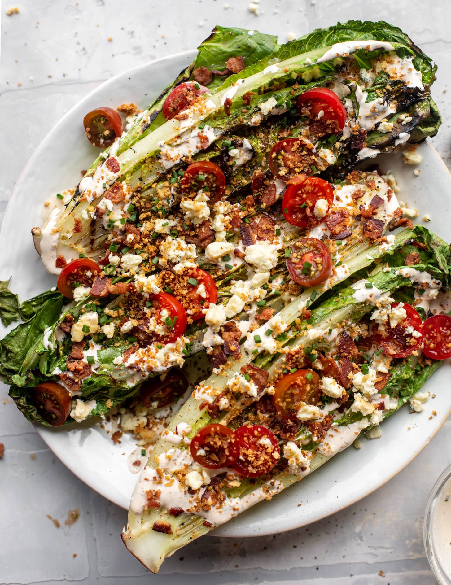 grilled romaine salads with tomatoes, bacon and ranch