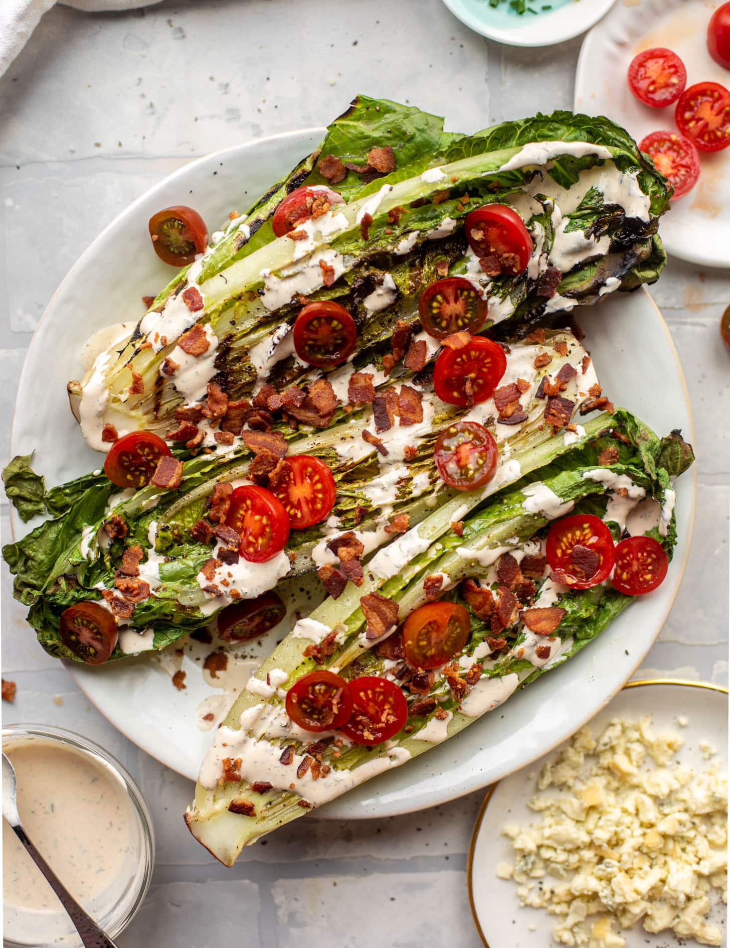 grilled romaine salads with tomatoes, bacon and ranch