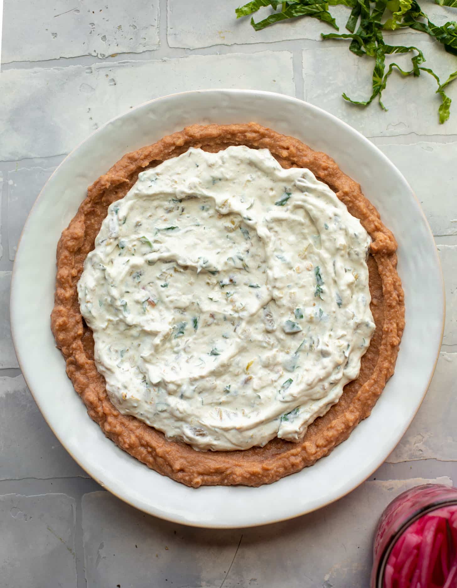 refried beans + sour cream + salsa verde