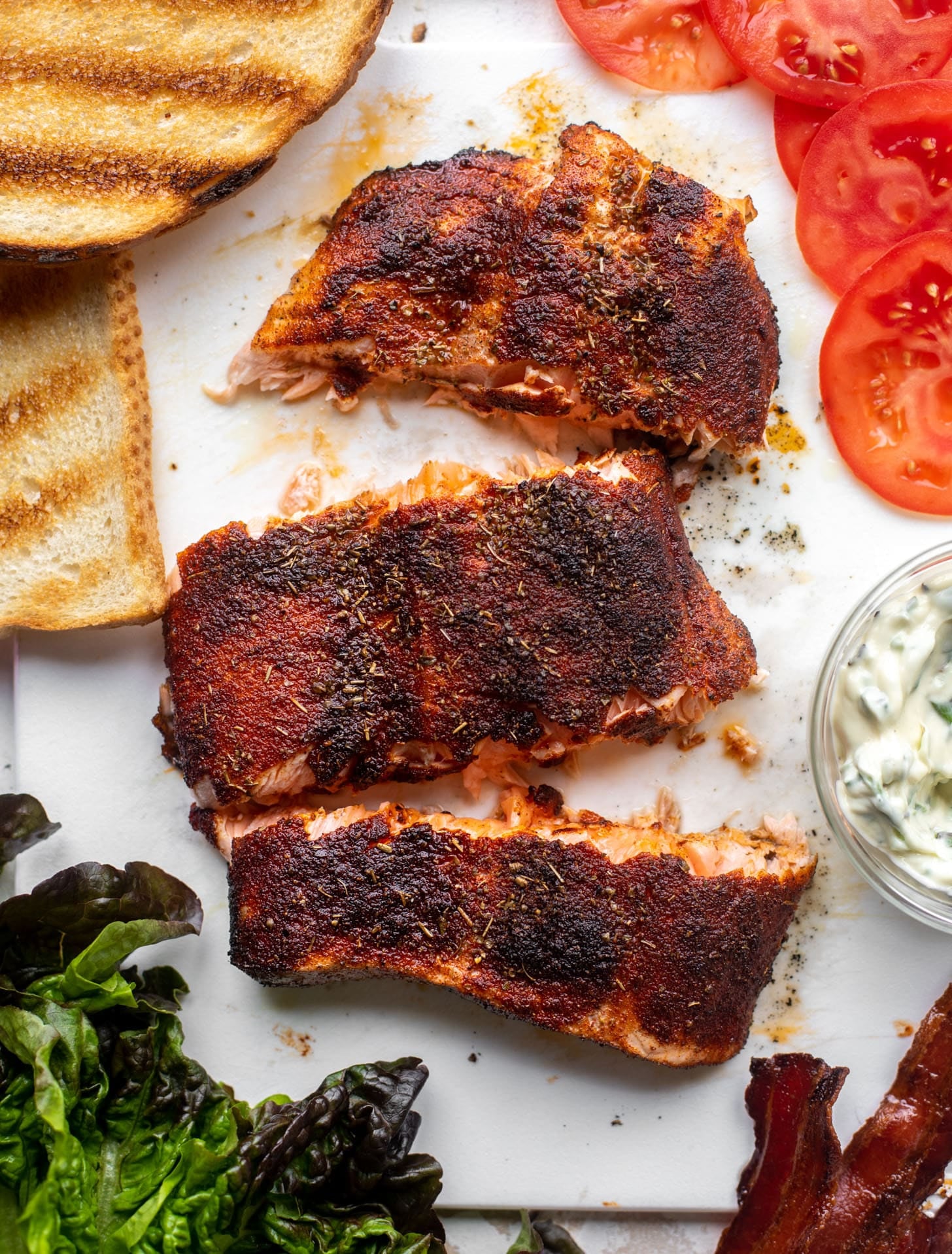 salmon club sandwich with charred scallion mayo