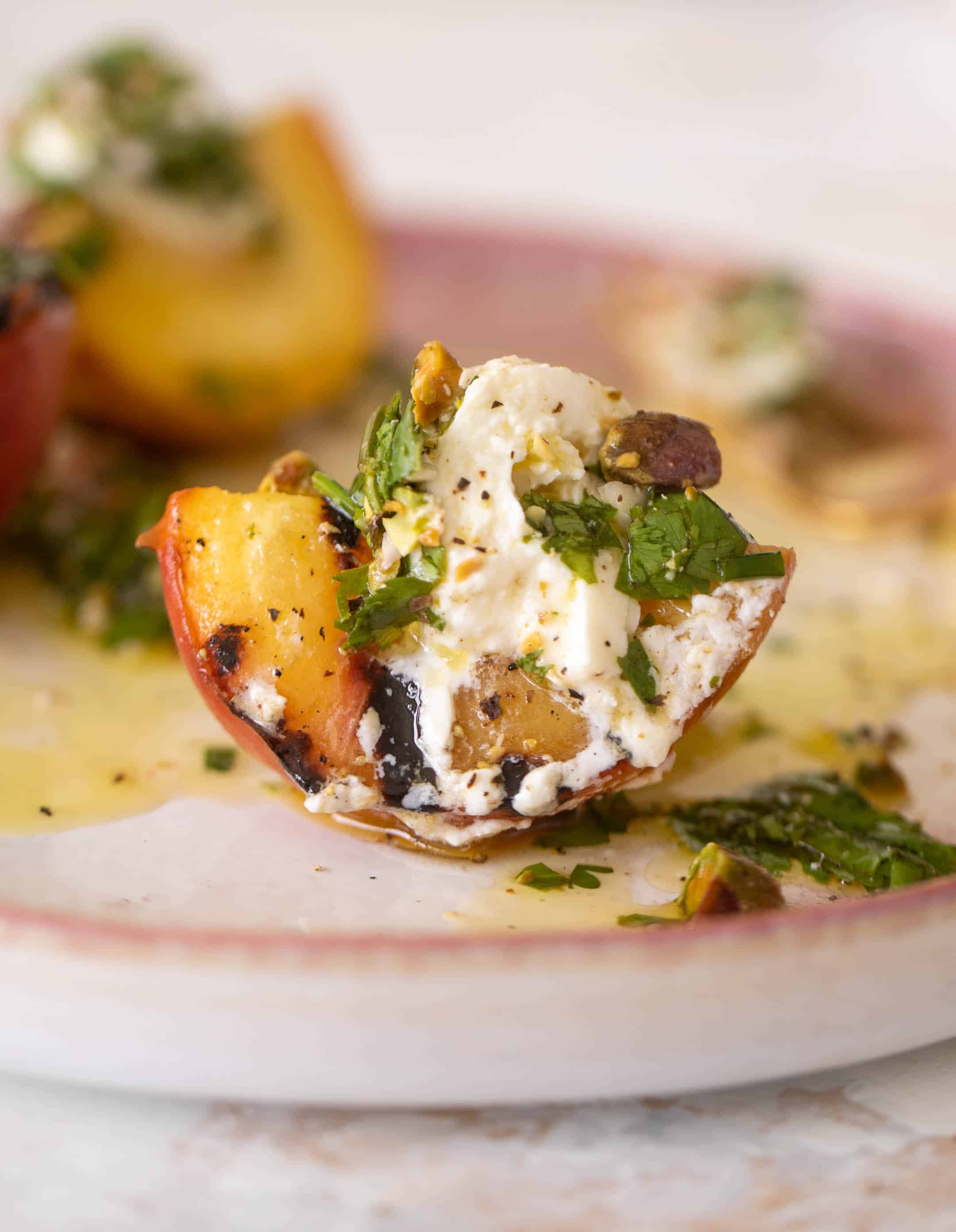 grilled peaches with burrata and pistachio vinaigrette