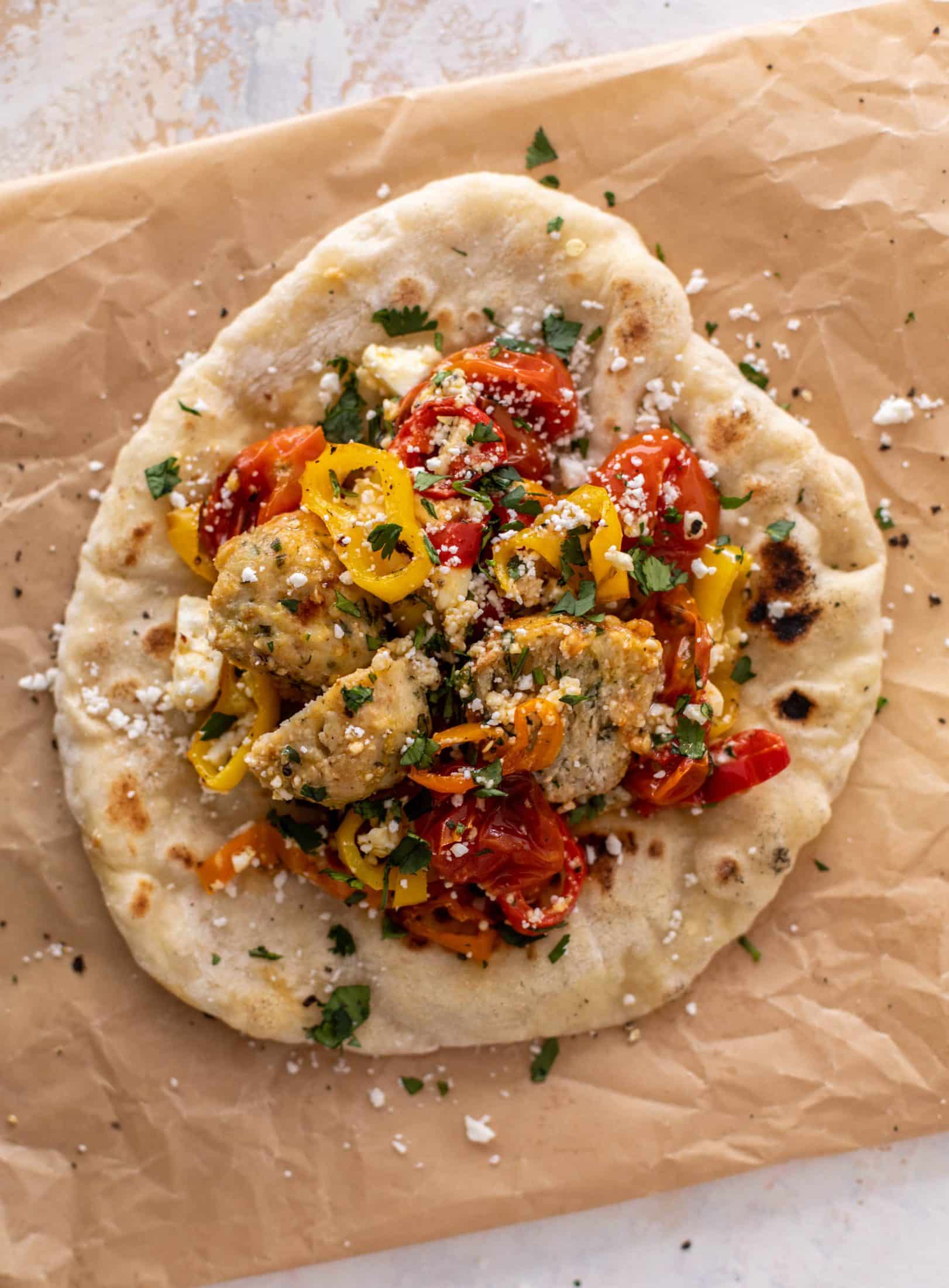 sheet pan chicken meatballs with tomatoes and feta