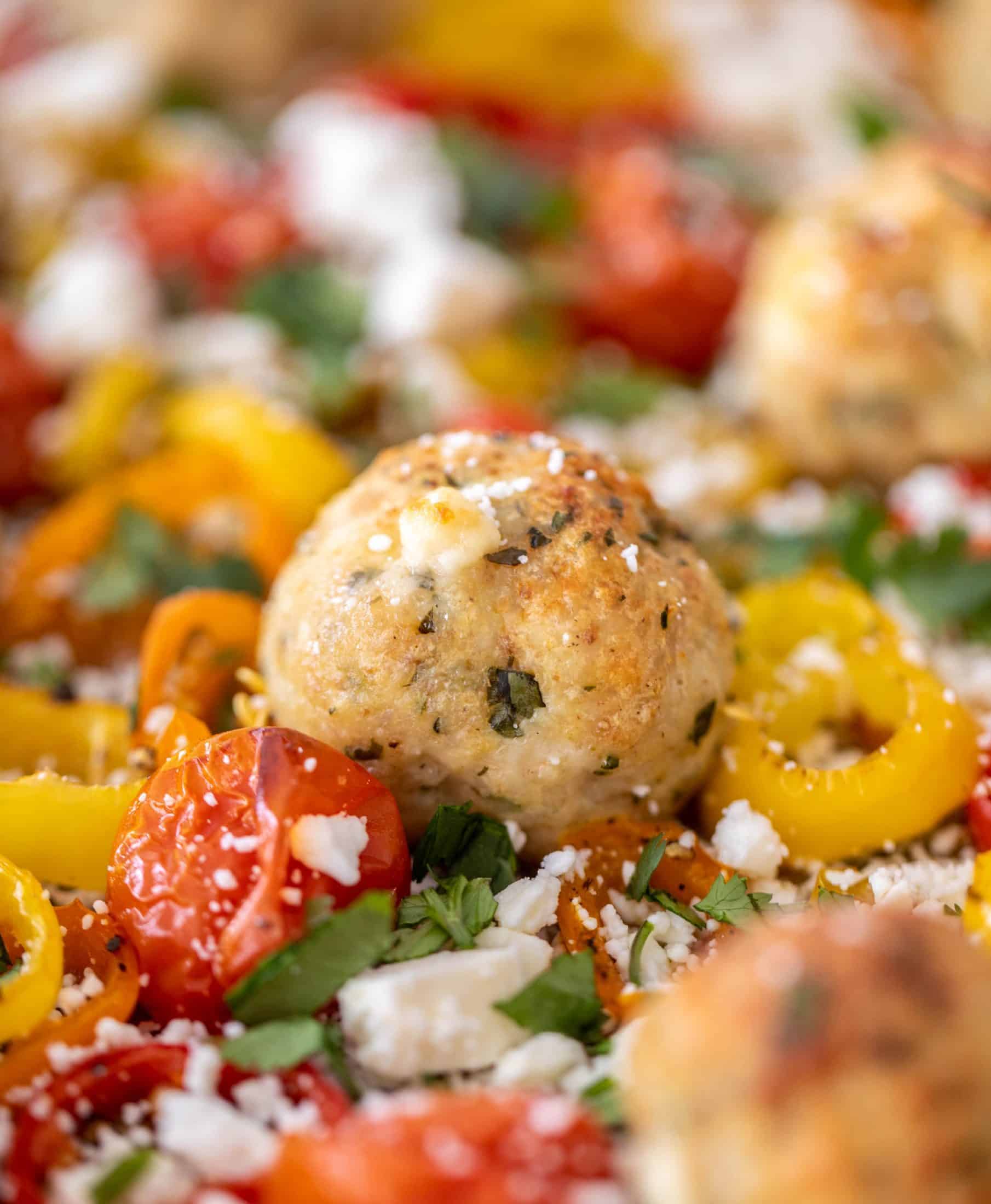 sheet pan chicken meatballs with tomatoes and feta