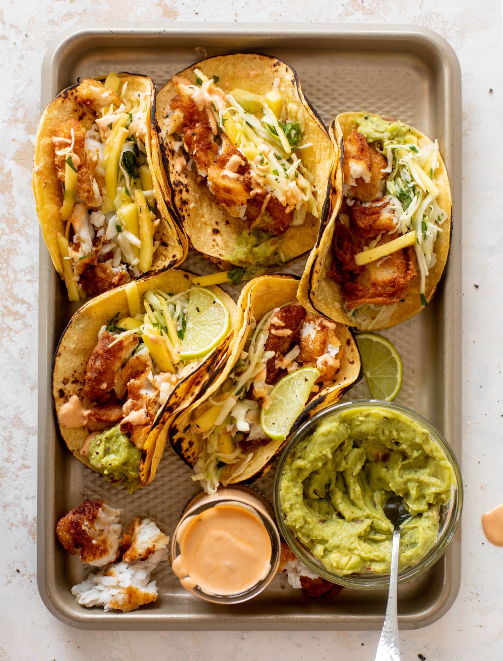 crispy fish tacos with mango slaw