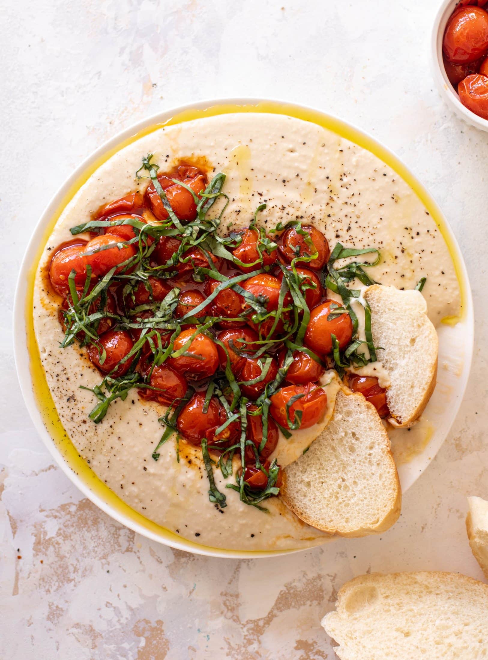 white bean dip with burst tomatoes
